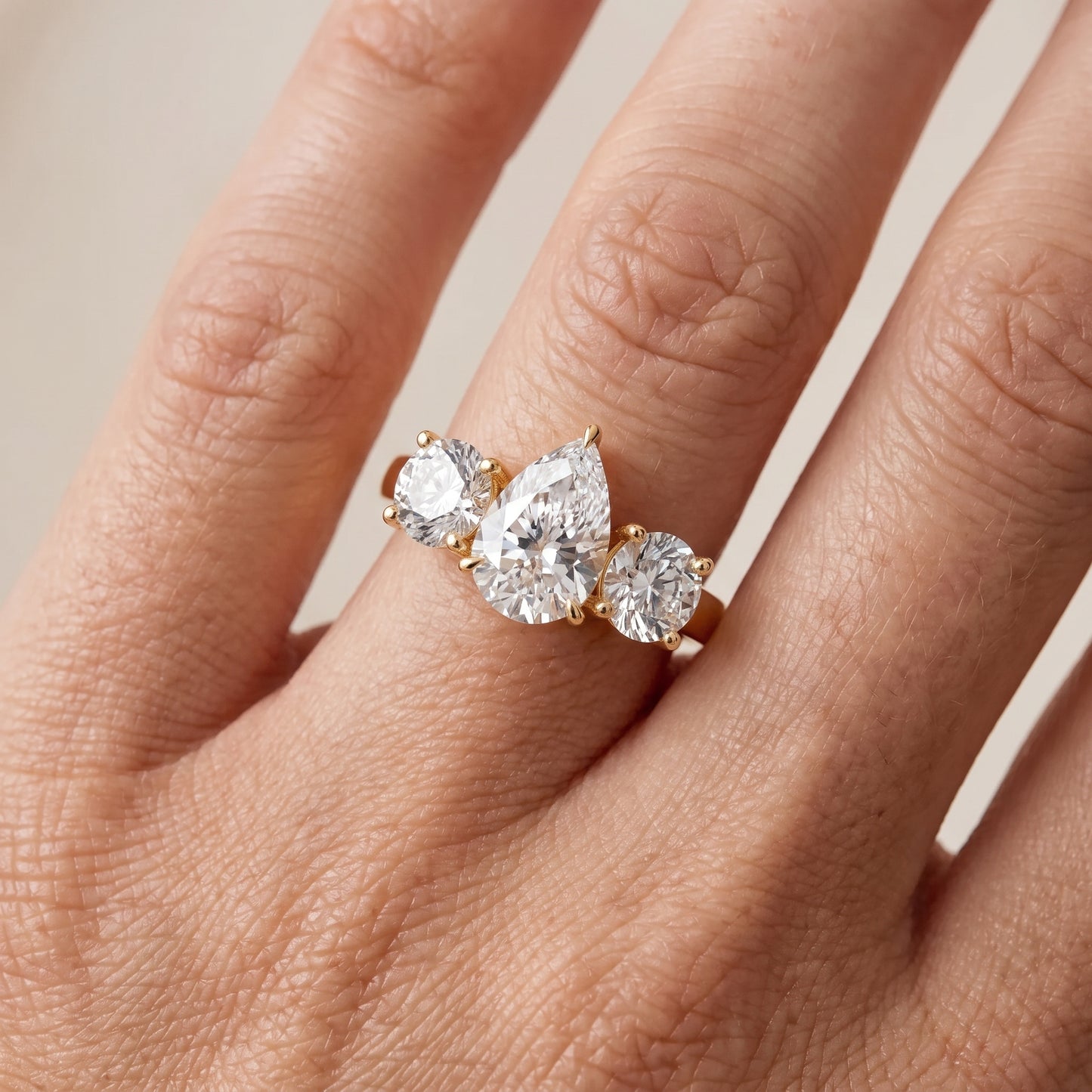 Esme Three-Stone Tapered Pear Diamond Ring in Yellow Gold - lifestyle.jpg