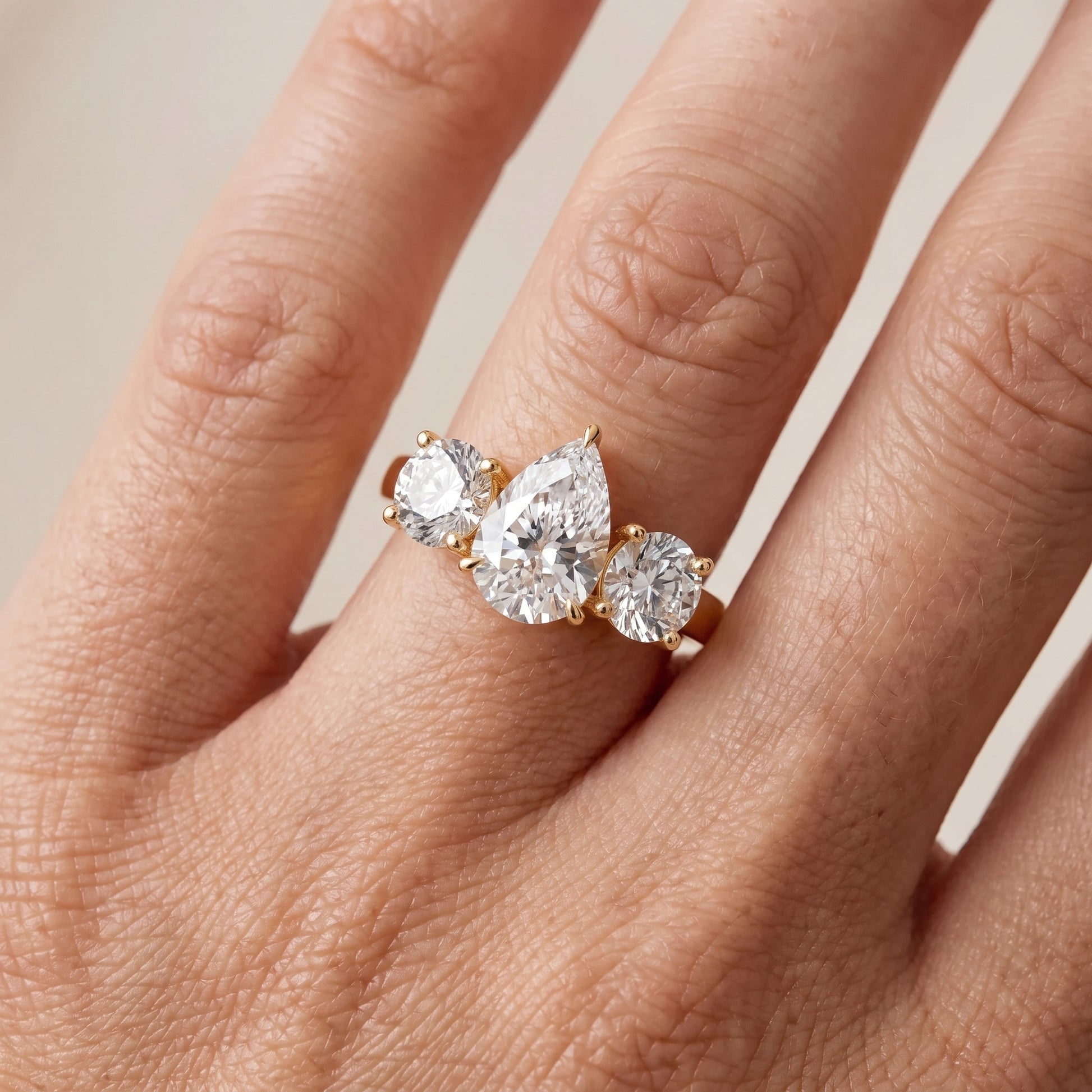 Esme Three-Stone Tapered Pear Diamond Ring in Yellow Gold - lifestyle.jpg