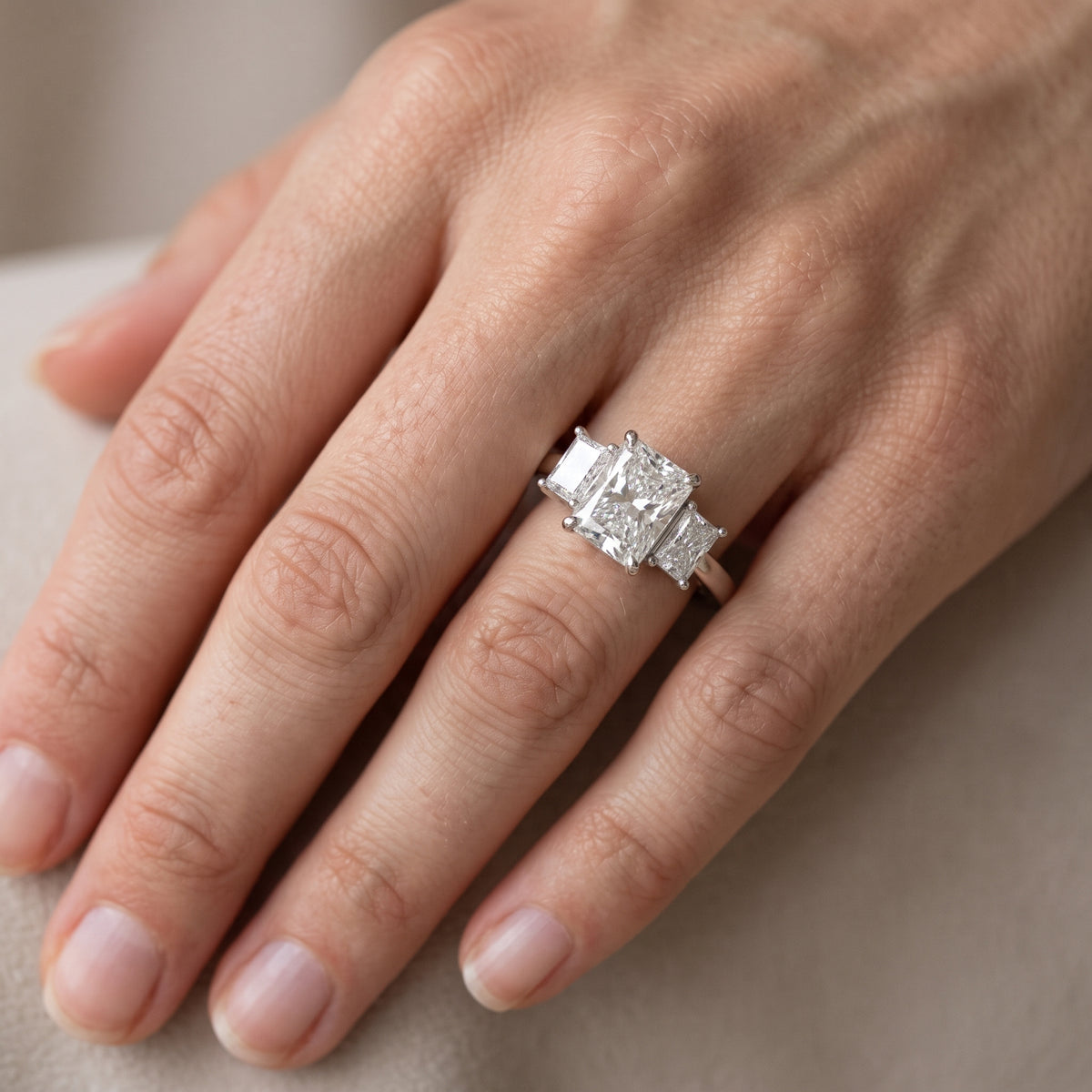 Zoe Three-Stone Radiant Diamond Engagement Ring in White Gold - lifestyle.jpg