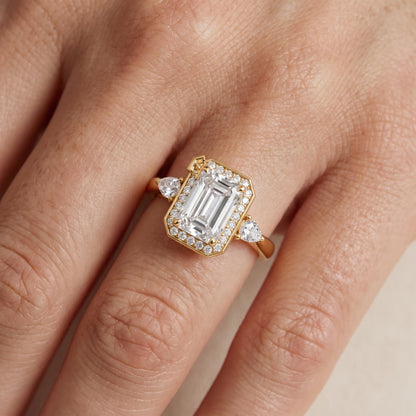 Eliza Halo Sidestone Emerald Diamond Engagement Ring in Yellow Gold - lifestyle.jpg