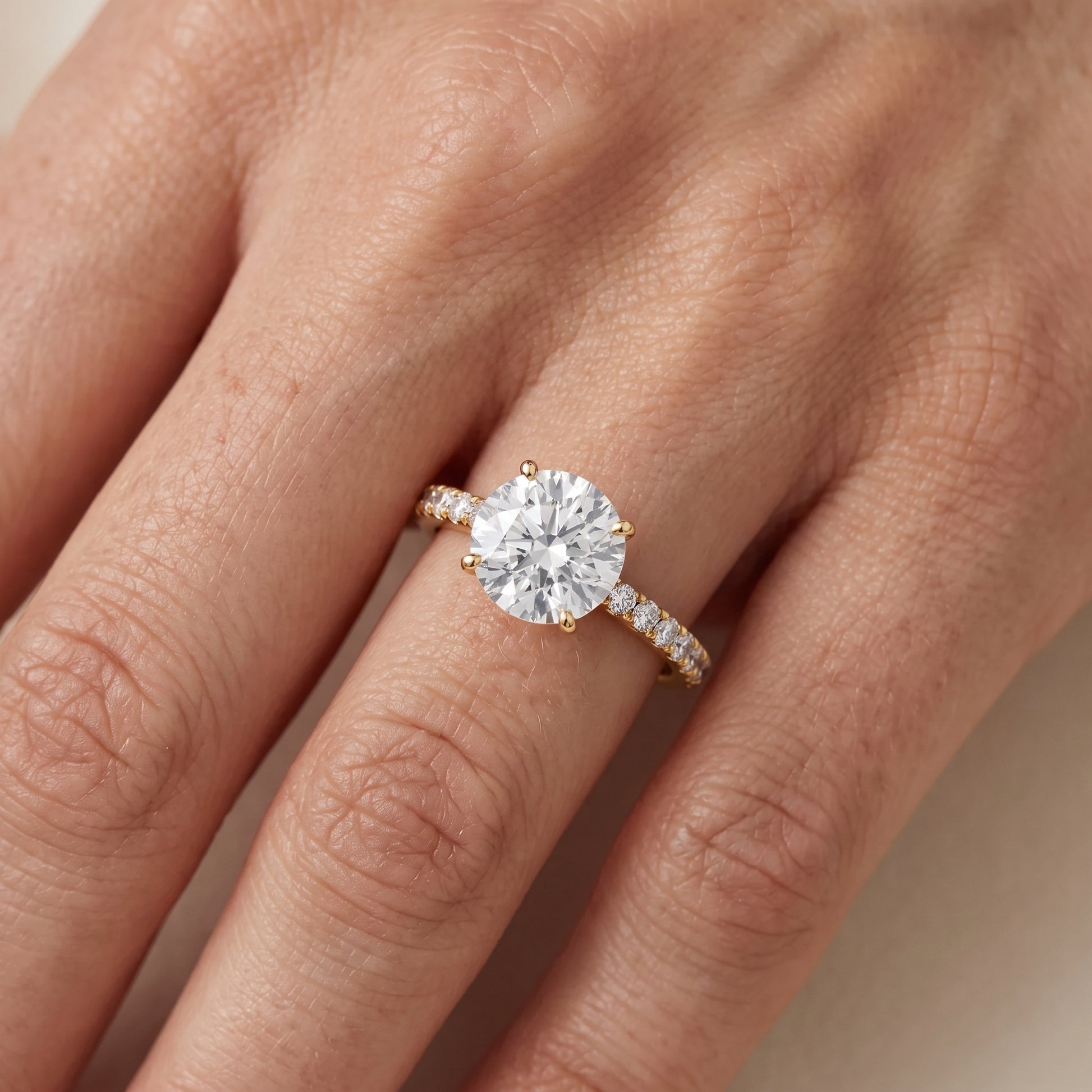 Juna French Pavé Solitaire Round Diamond Engagement Ring in Yellow Gold - lifestyle.jpg
