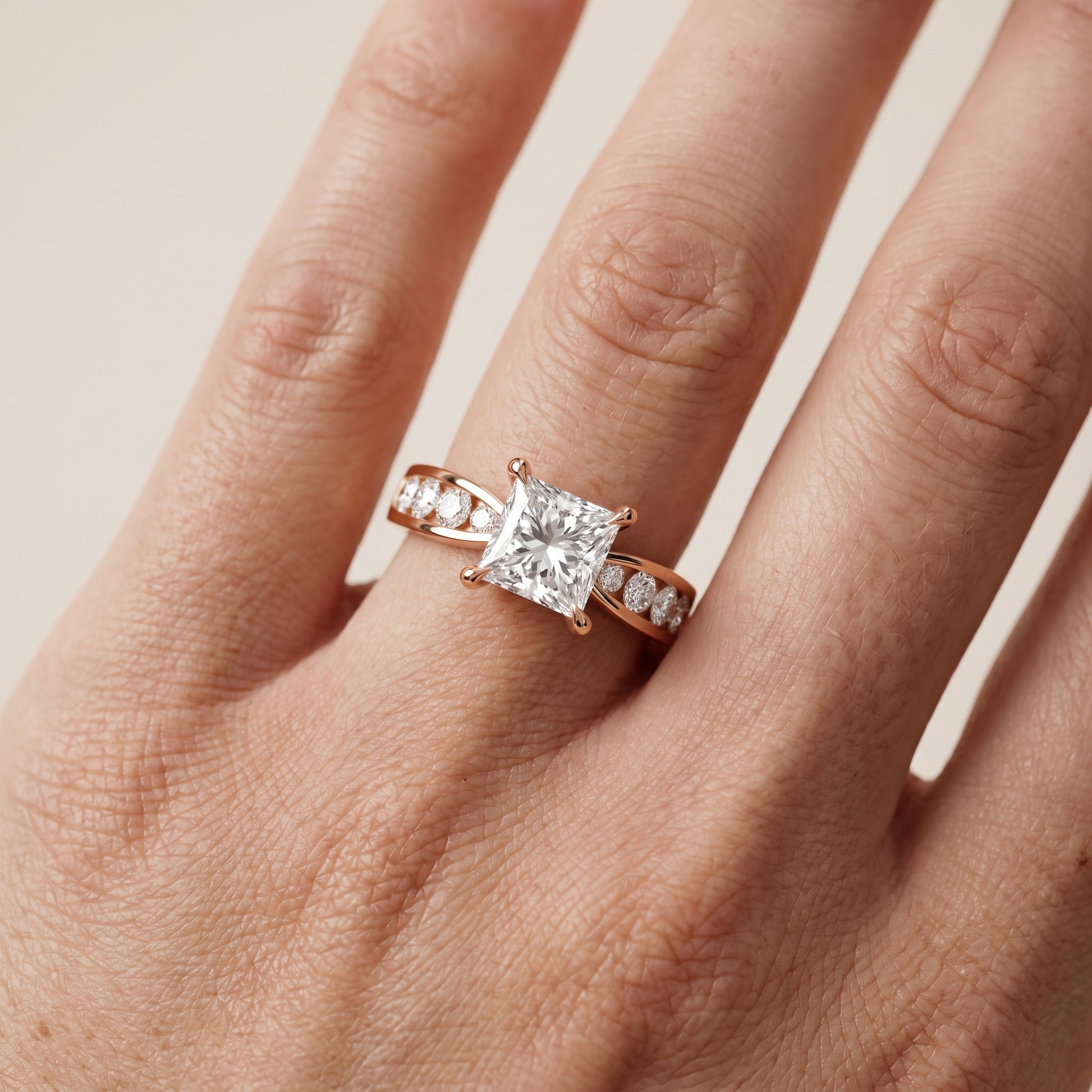 Noor Channel Set Sidestone Princess Diamond Engagement Ring in Rose Gold - lifestyle.jpg