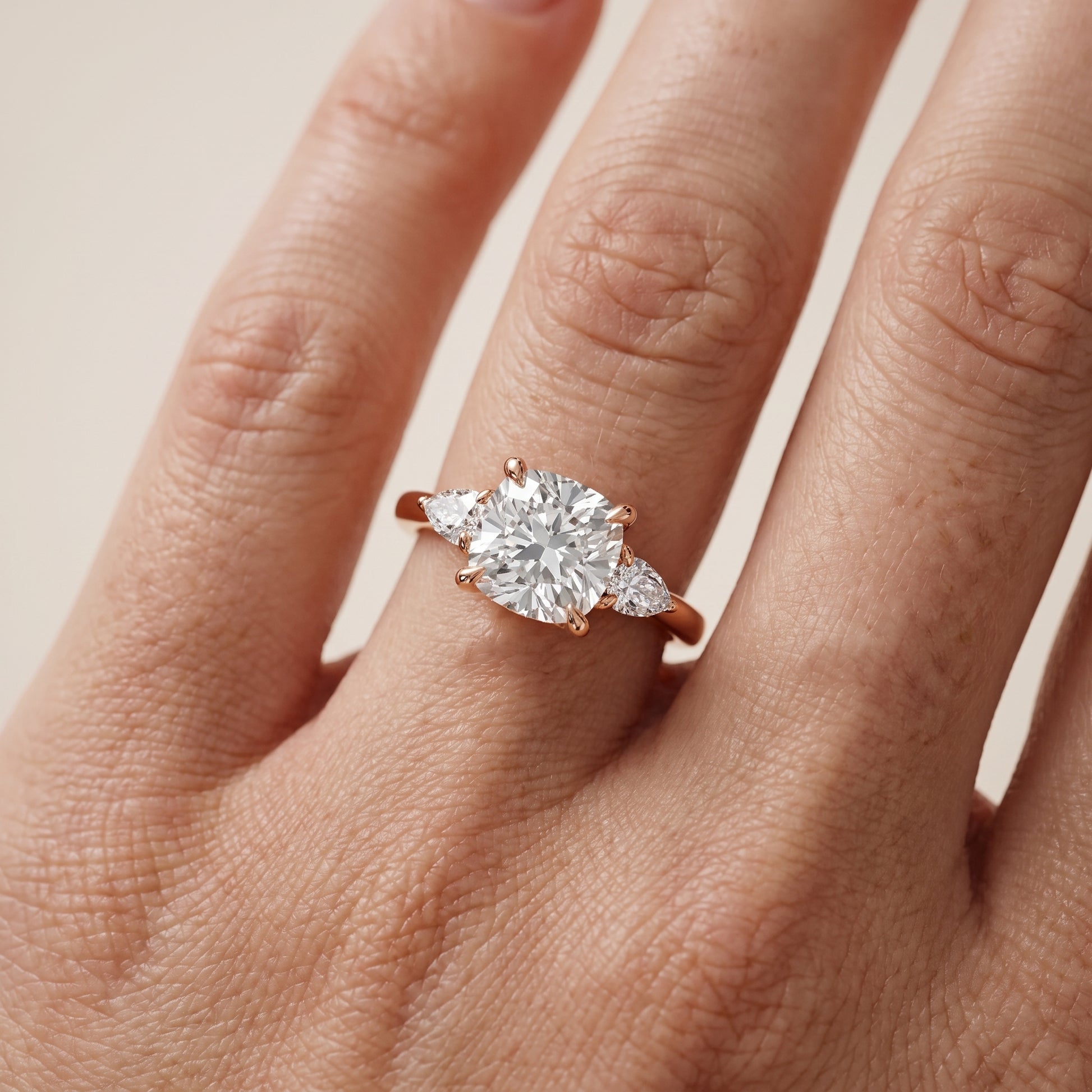 Leila Three-Stone Cushion Diamond Engagement Ring in Rose Gold - lifestyle.jpg