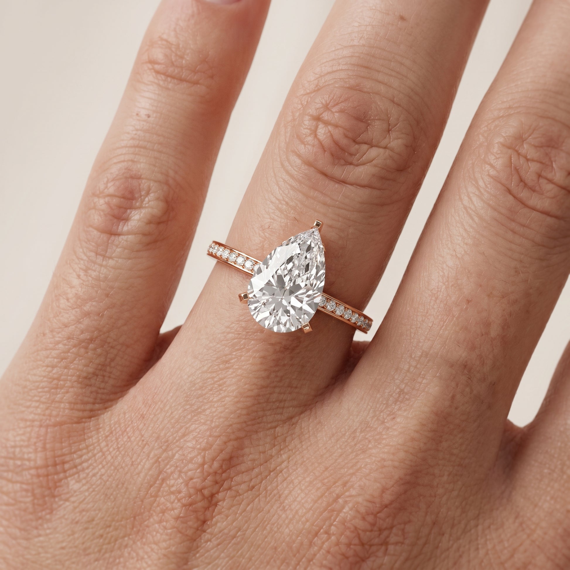 Naia Hidden Halo Pear Diamond Ring in Rose Gold - lifestyle.jpg