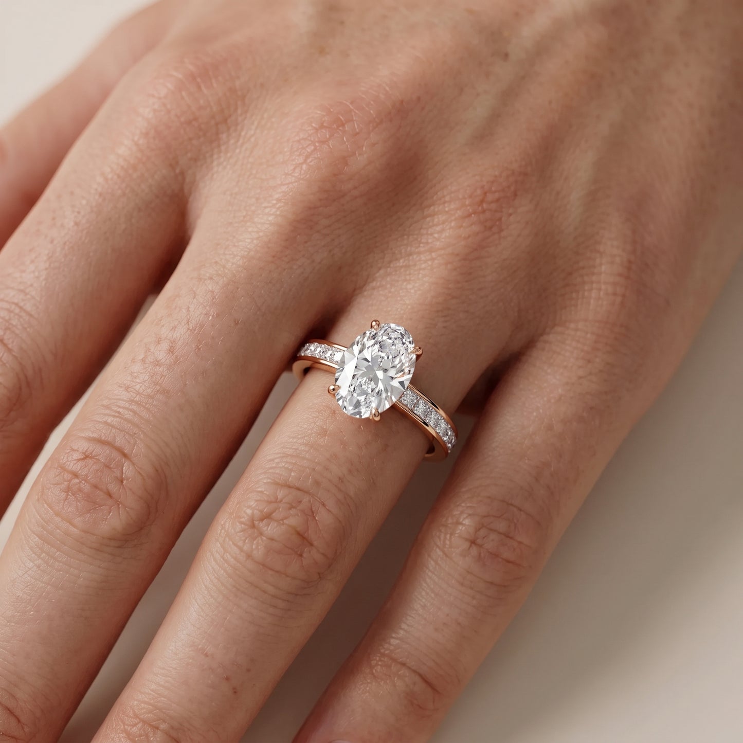 Brielle Channel Set Solitaire Oval Diamond Ring in Rose Gold - lifestyle.jpg