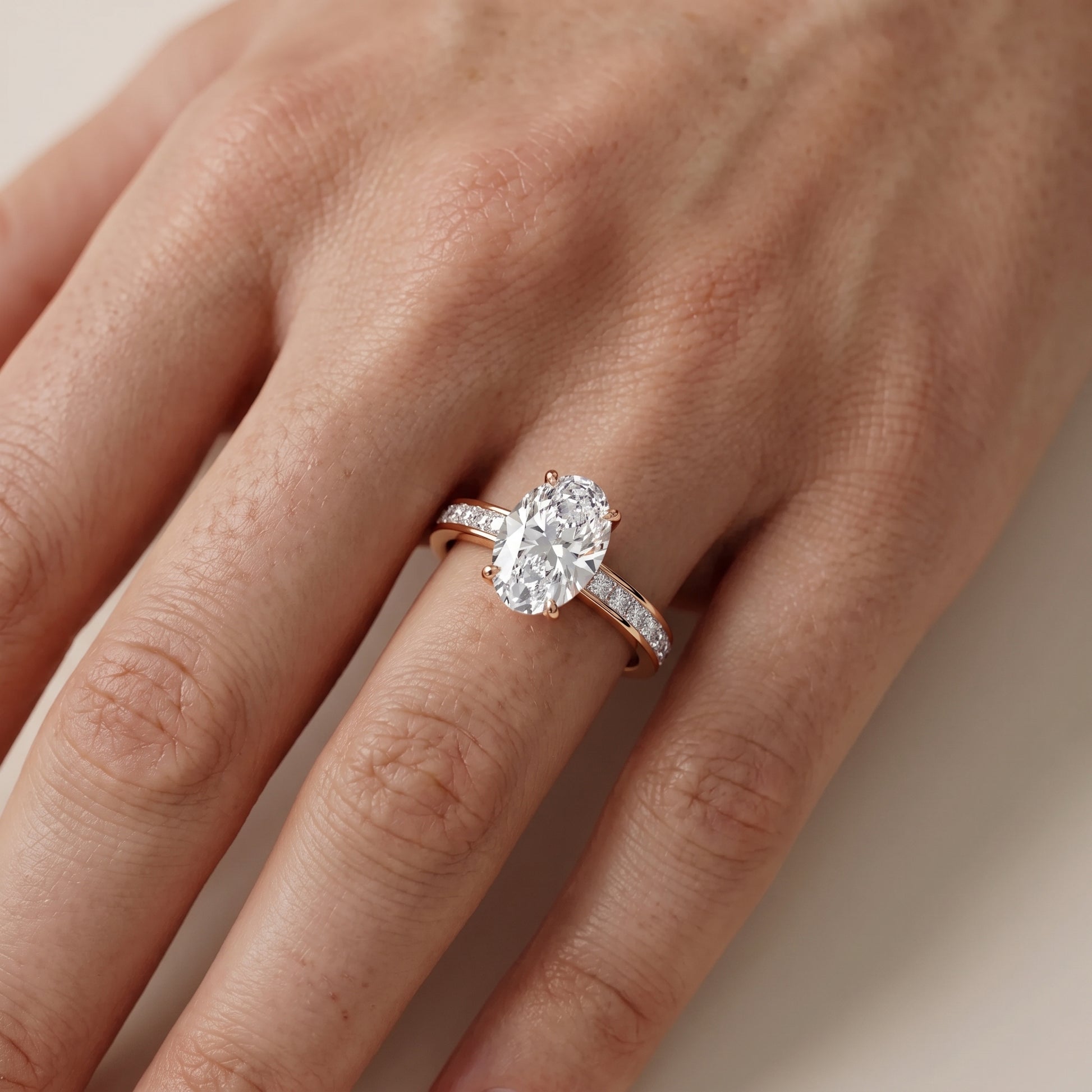 Brielle Channel Set Solitaire Oval Diamond Ring in Rose Gold - lifestyle.jpg