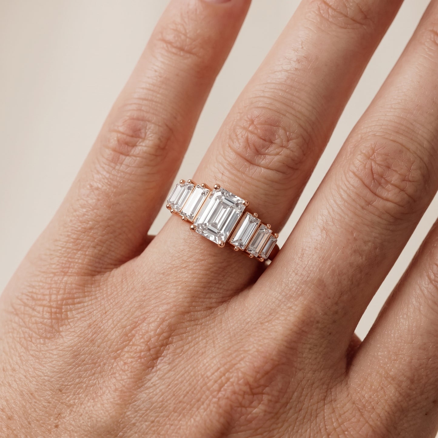 Mara Sidestone Baguette Accent Emerald Diamond Engagement Ring in Rose Gold - lifestyle.jpg