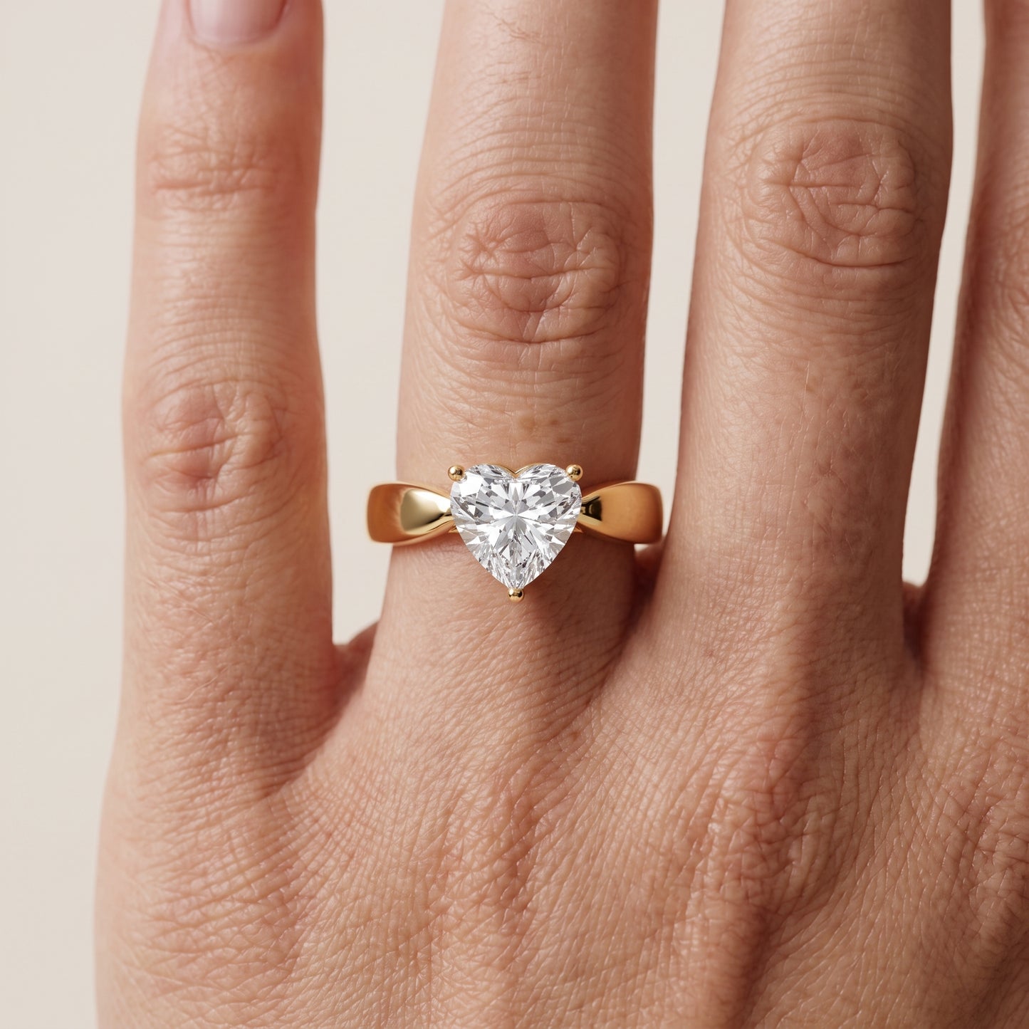 Talia Solitaire Twist Heart Diamond Engagement Ring in Yellow Gold - lifestyle.jpg