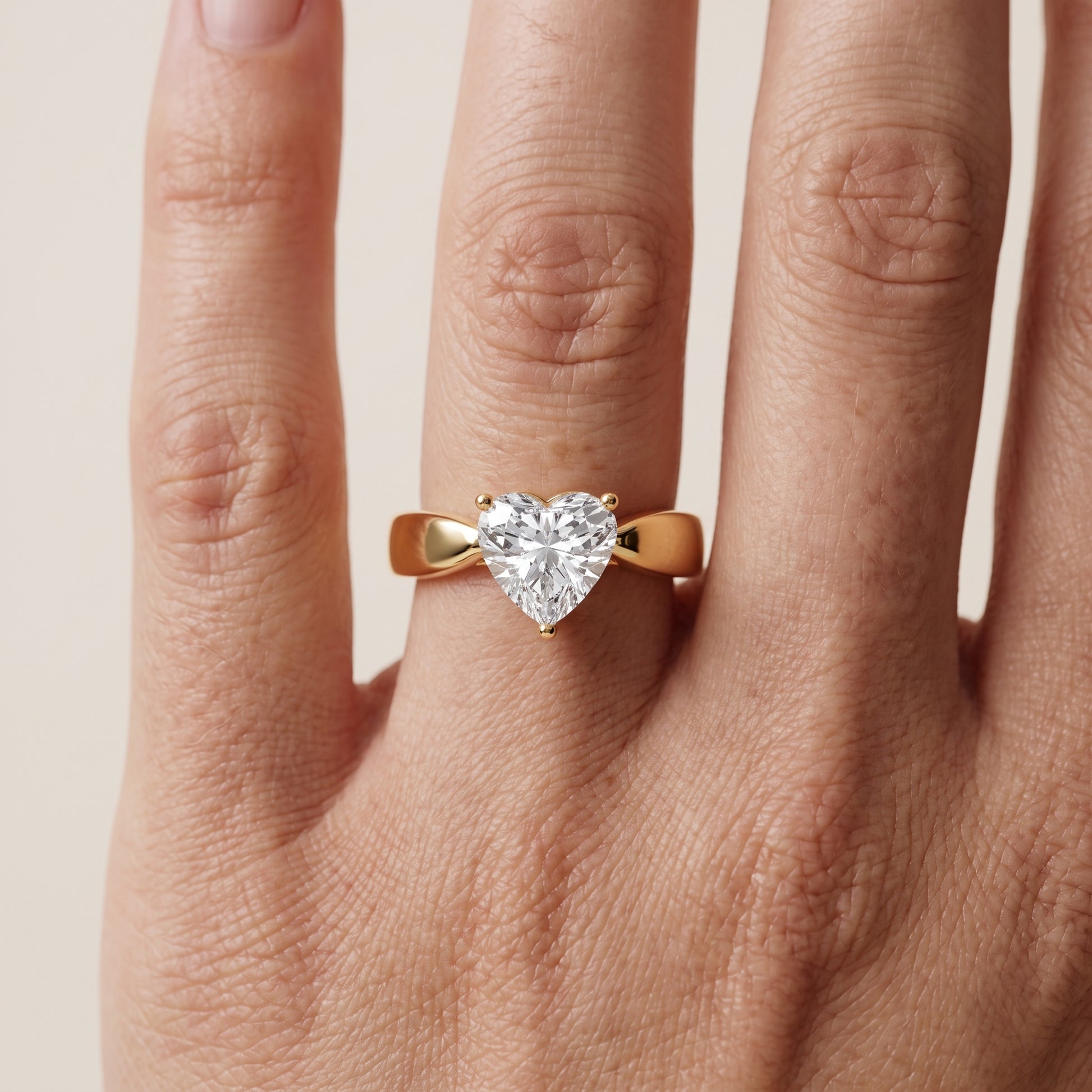 Talia Solitaire Twist Heart Diamond Engagement Ring in Yellow Gold - lifestyle.jpg