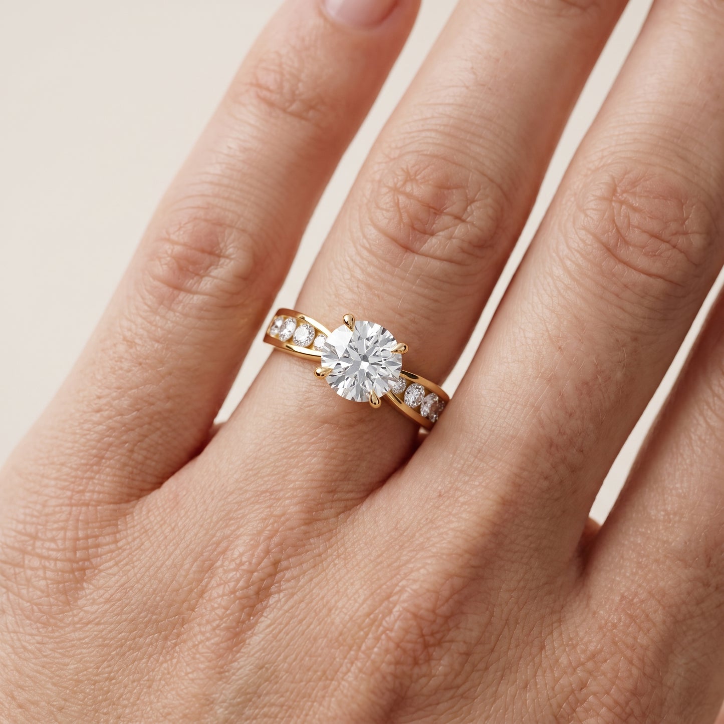 Noor Channel Set Sidestone Round Diamond Engagement Ring in Yellow Gold - lifestyle.jpg