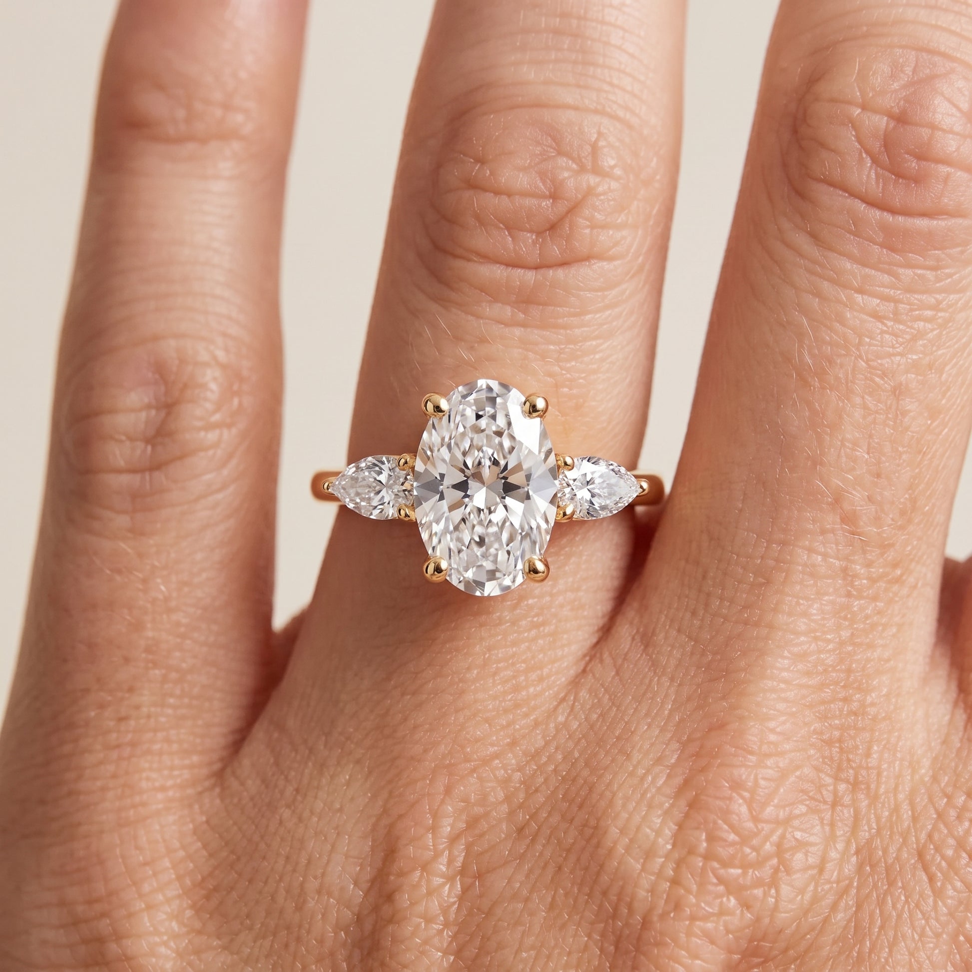 Faye Three-Stone Trellis Oval Diamond Ring in Yellow Gold - lifestyle.jpg