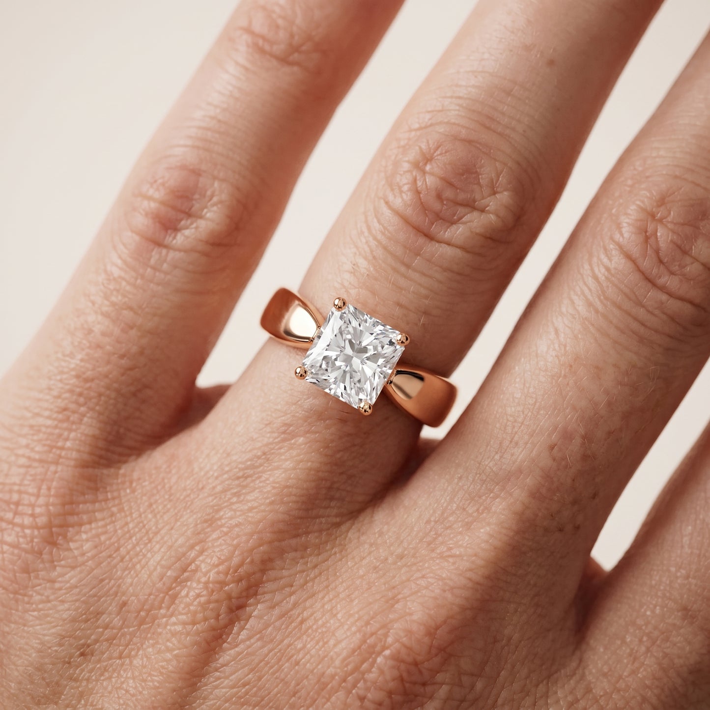 Talia Solitaire Twist Radiant Diamond Engagement Ring in Rose Gold - lifestyle.jpg