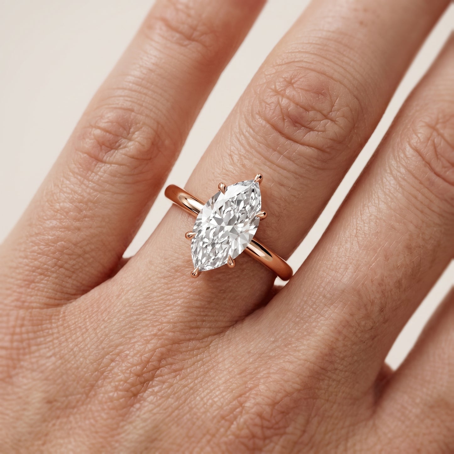 Lyla Petite Solitaire Marquise Diamond Engagement Ring in Rose Gold - lifestyle.jpg