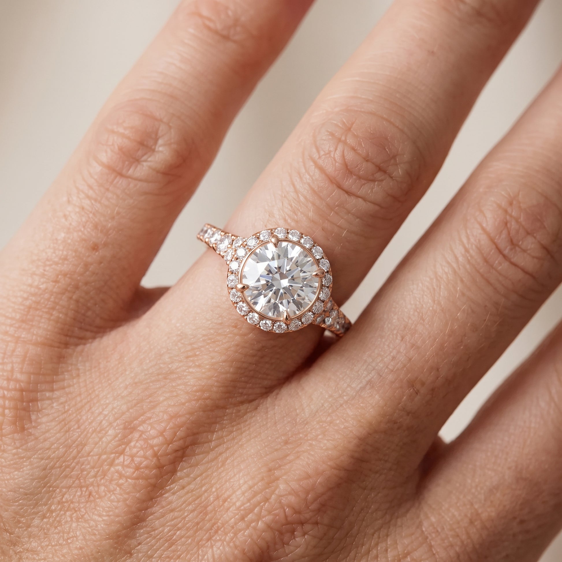 Bella Halo Pavé Round Diamond Engagement Ring in Rose Gold - lifestyle.jpg