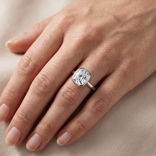 Carina Bezel Hidden Halo Cushion Diamond Engagement Ring in Platinum - lifestyle.jpg