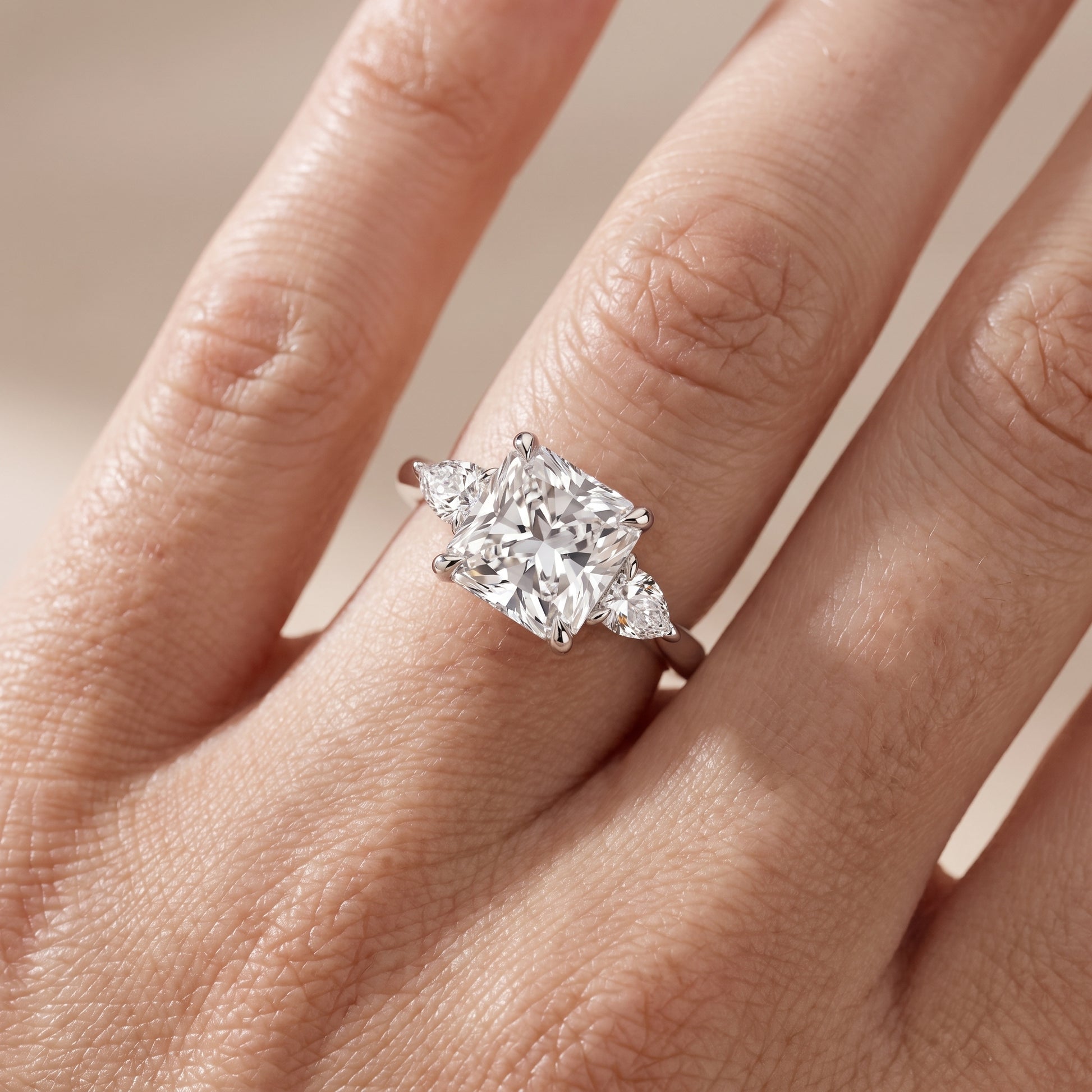 Leila Three-Stone Radiant Diamond Engagement Ring in White Gold - lifestyle.jpg