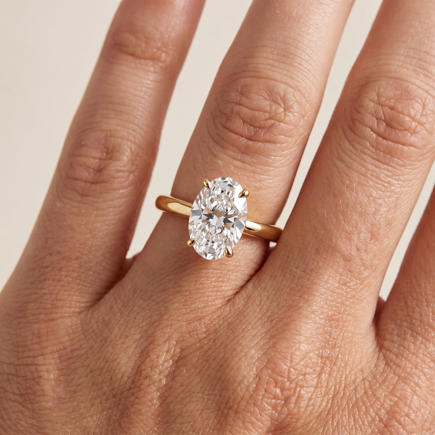 Kalia Knife Edge Solitaire Oval Diamond Engagement Ring in Yellow Gold - lifestyle.jpg