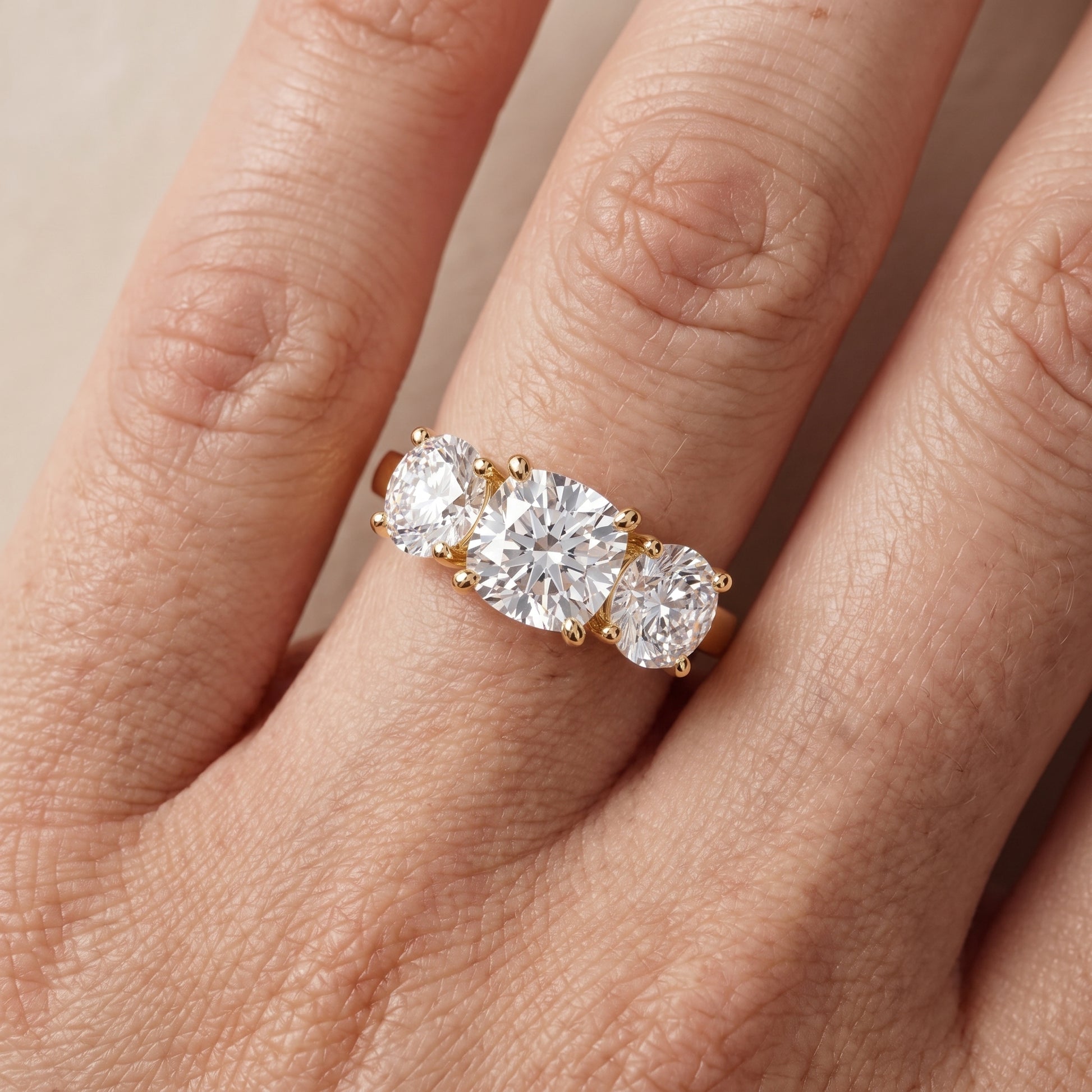 Esme Three-Stone Tapered Cushion Diamond Ring in Yellow Gold - lifestyle.jpg