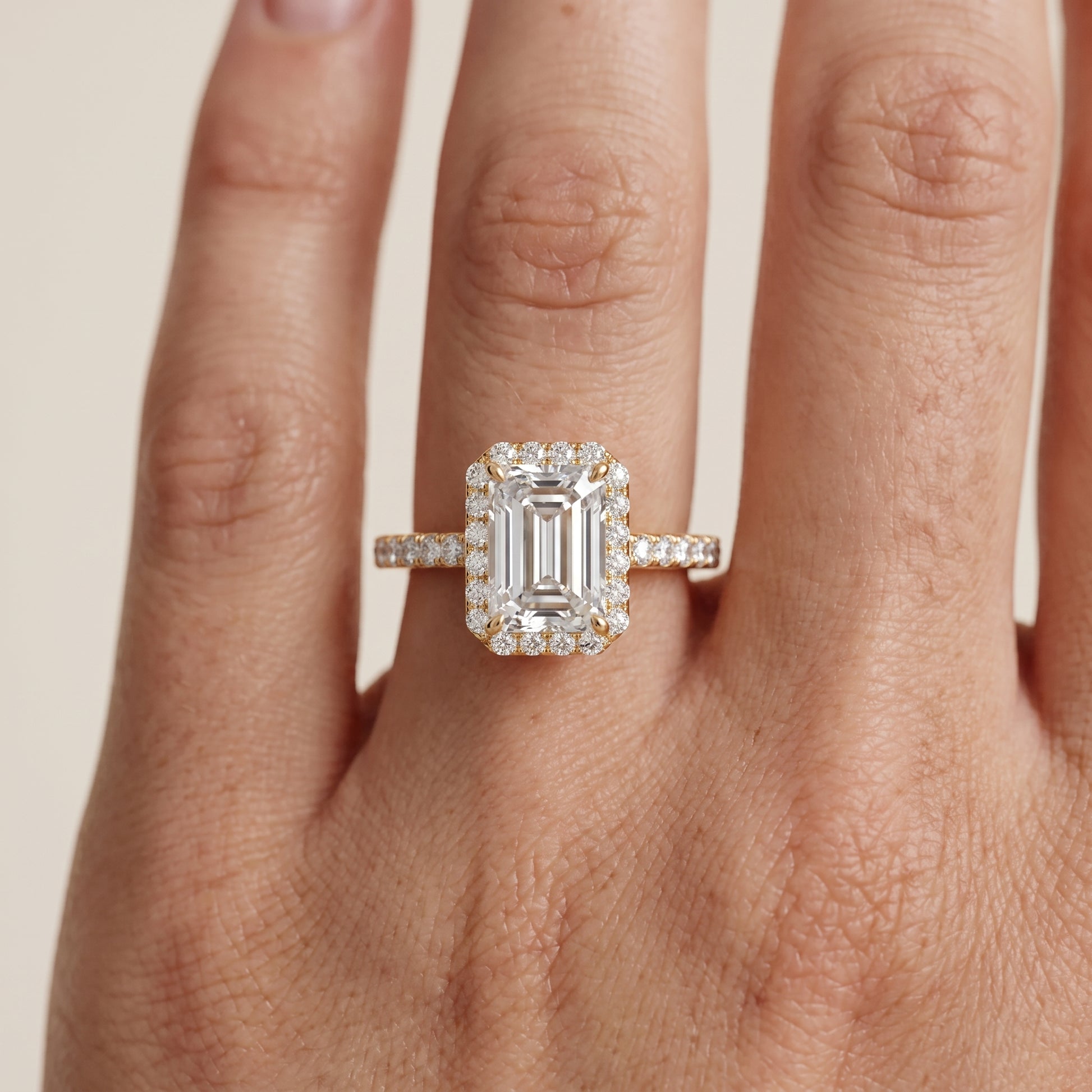 Willa Halo Micropavé Emerald Diamond Engagement Ring in Yellow Gold - lifestyle.jpg