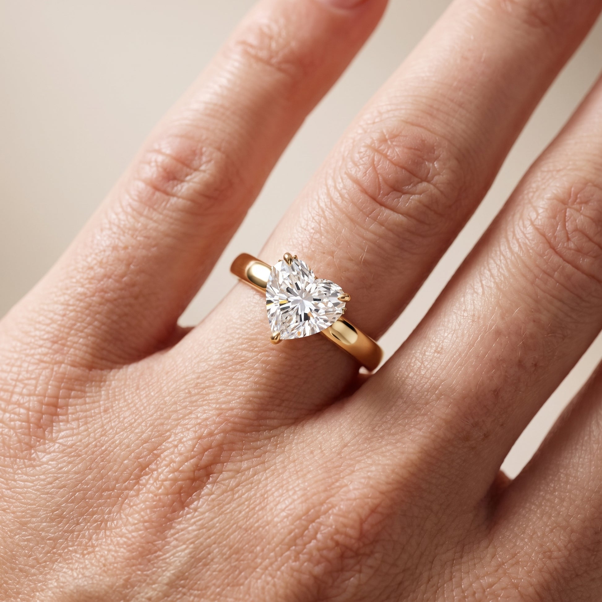 Lara Hidden Halo Heart Diamond Engagement Ring in Yellow Gold - lifestyle.jpg