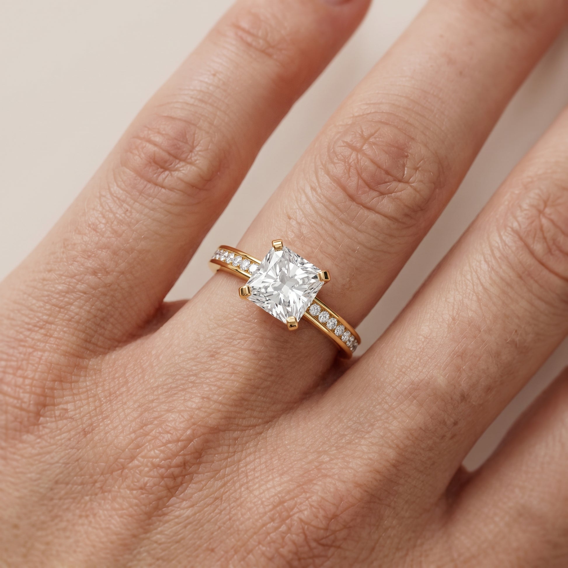 Tessa Solitaire Channel Set Radiant Diamond Engagement Ring in Yellow Gold - lifestyle.jpg