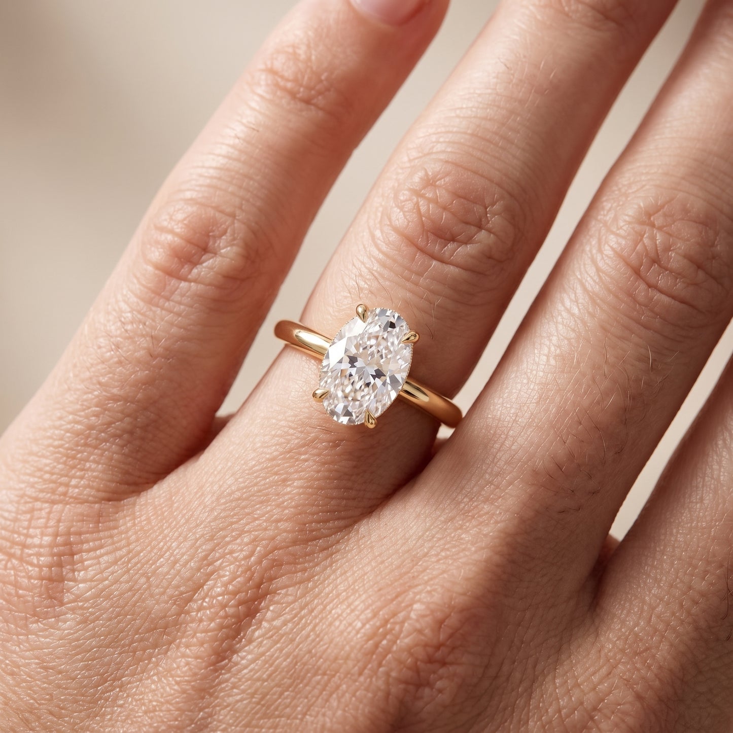 Amaya Hidden Halo Oval Diamond Ring in Yellow Gold - lifestyle.jpg