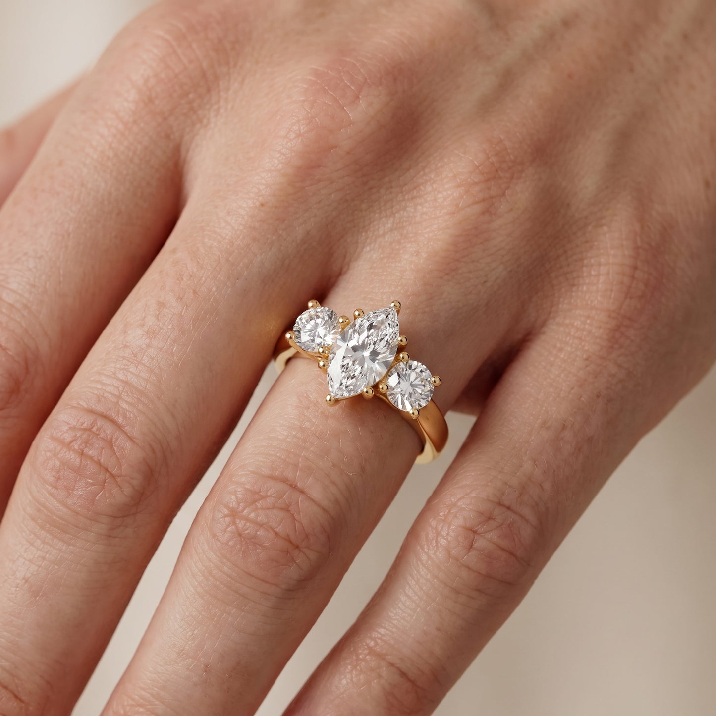 Callie Three-Stone Trellis Marquise Diamond Engagement Ring in Yellow Gold - lifestyle.jpg