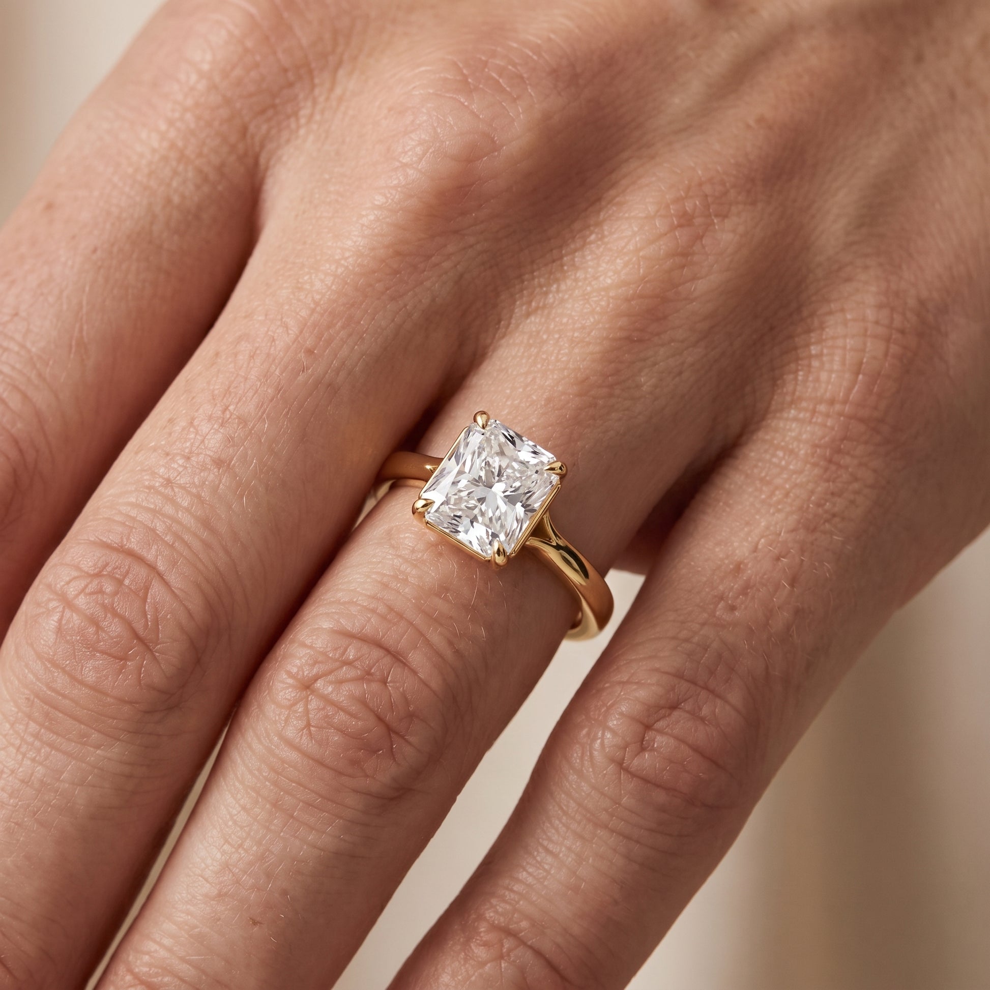 Anais Trellis Solitaire Radiant Diamond Engagement Ring in Yellow Gold - lifestyle.jpg