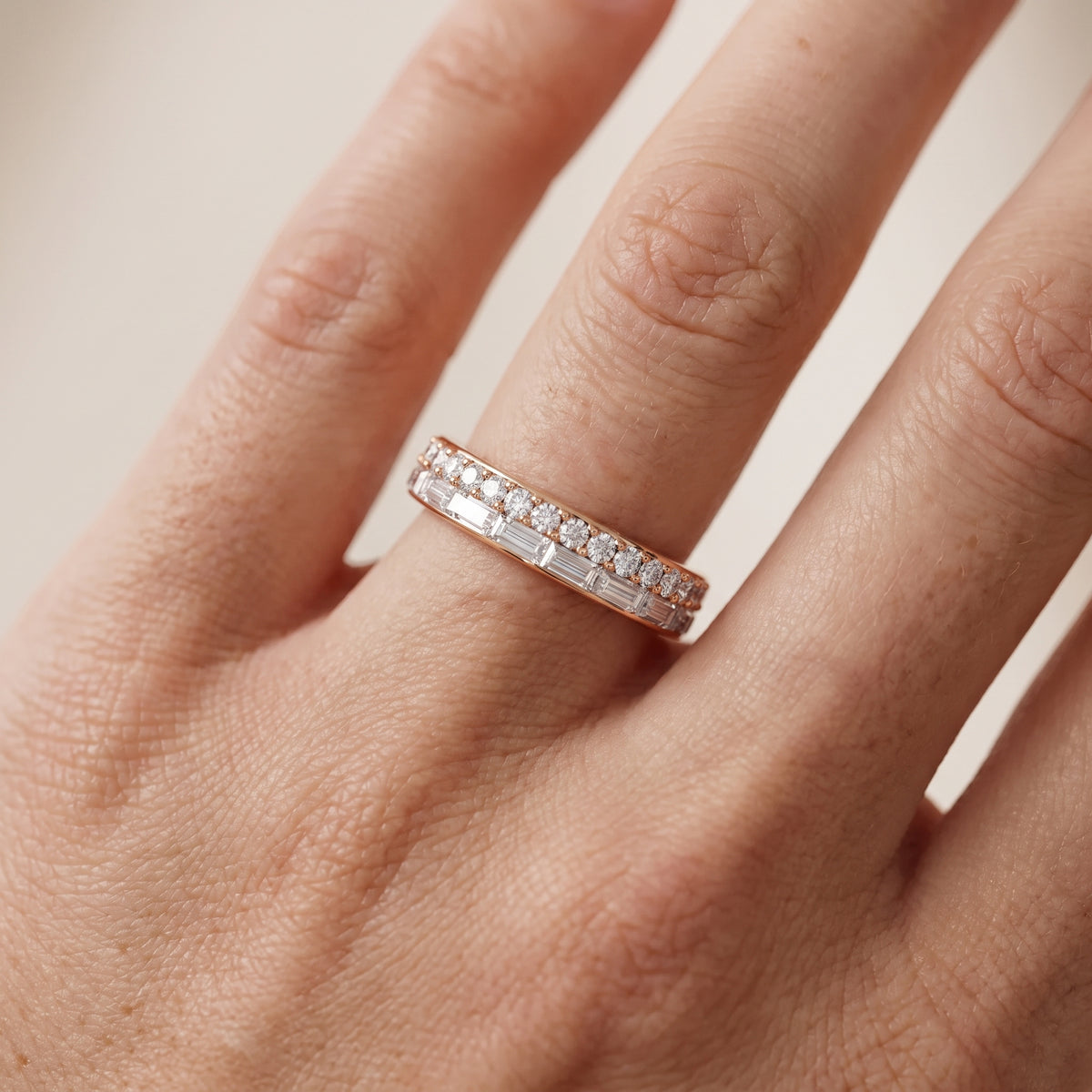 Genevieve Channel Set Round & Baguette Diamond Anniversary Ring in Rose Gold - lifestyle.jpg