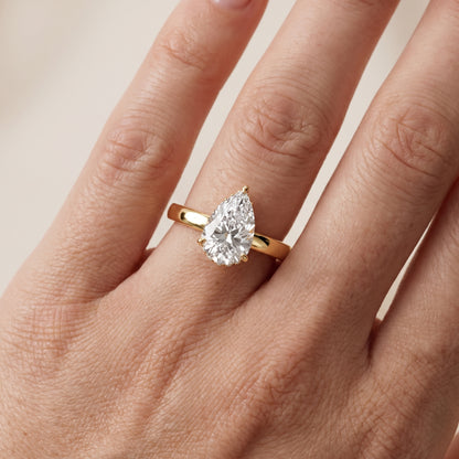 Lara Hidden Halo Pear Diamond Engagement Ring in Yellow Gold - lifestyle.jpg