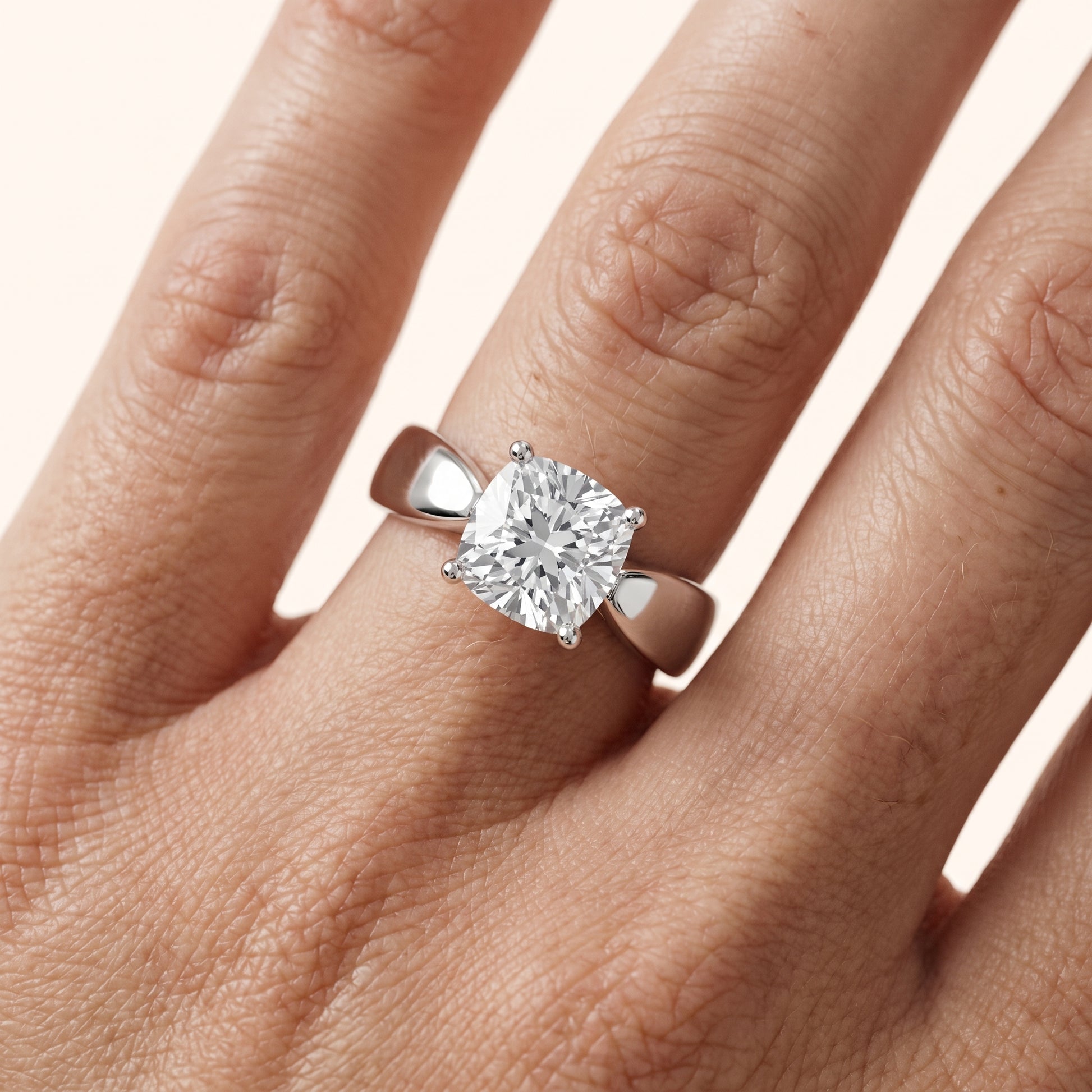 Talia Solitaire Twist Cushion Diamond Engagement Ring in Platinum - lifestyle.jpg
