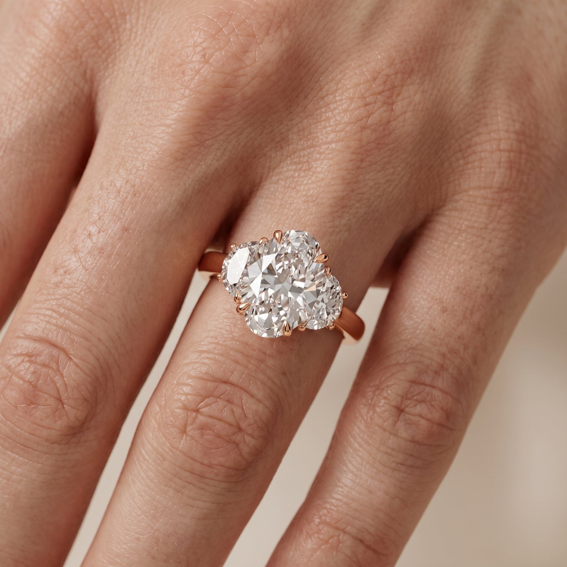 Romy Three-Stone Oval Diamond Engagement Ring in Rose Gold - lifestyle.jpg