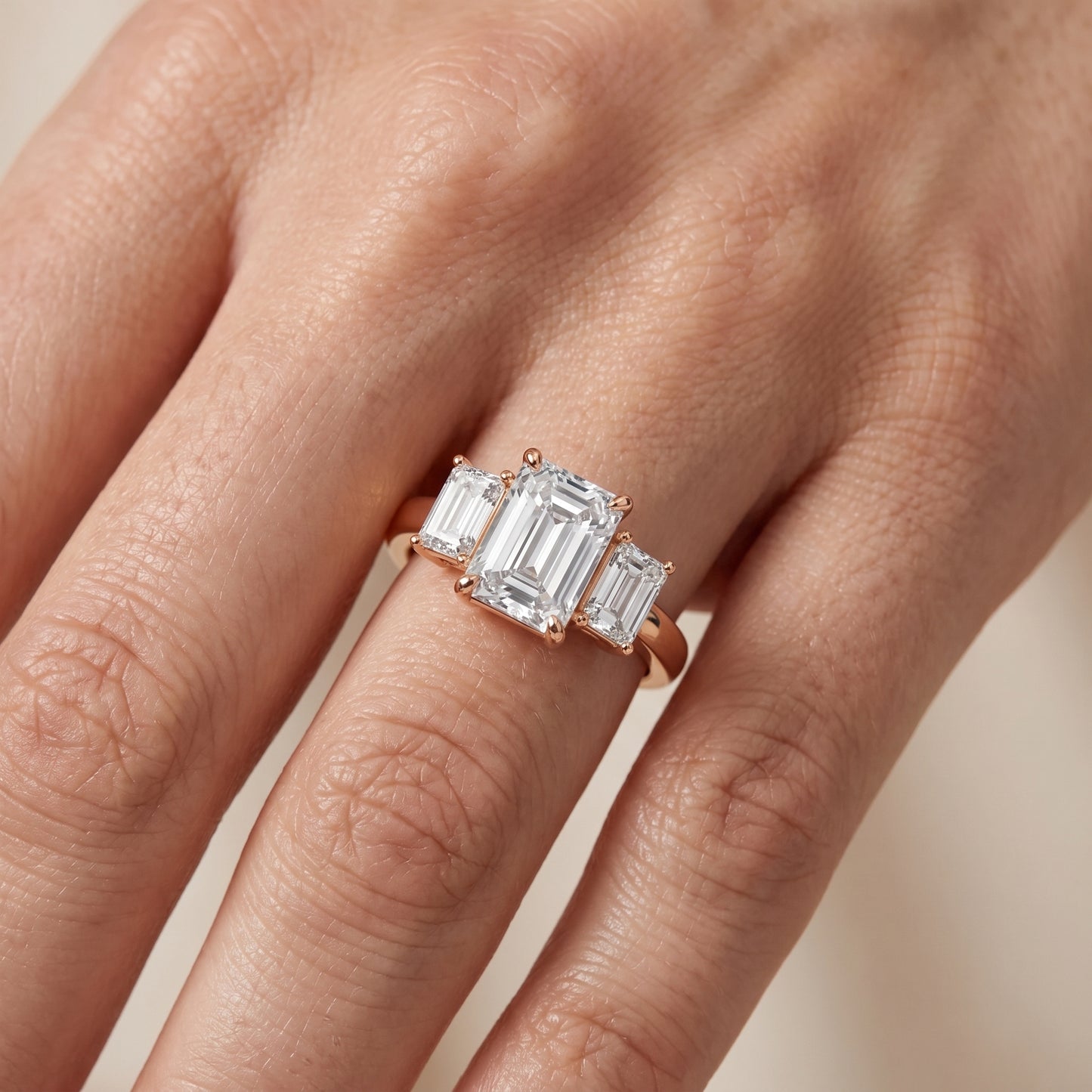Zoe Three-Stone Emerald Diamond Ring in Rose Gold - lifestyle.jpg