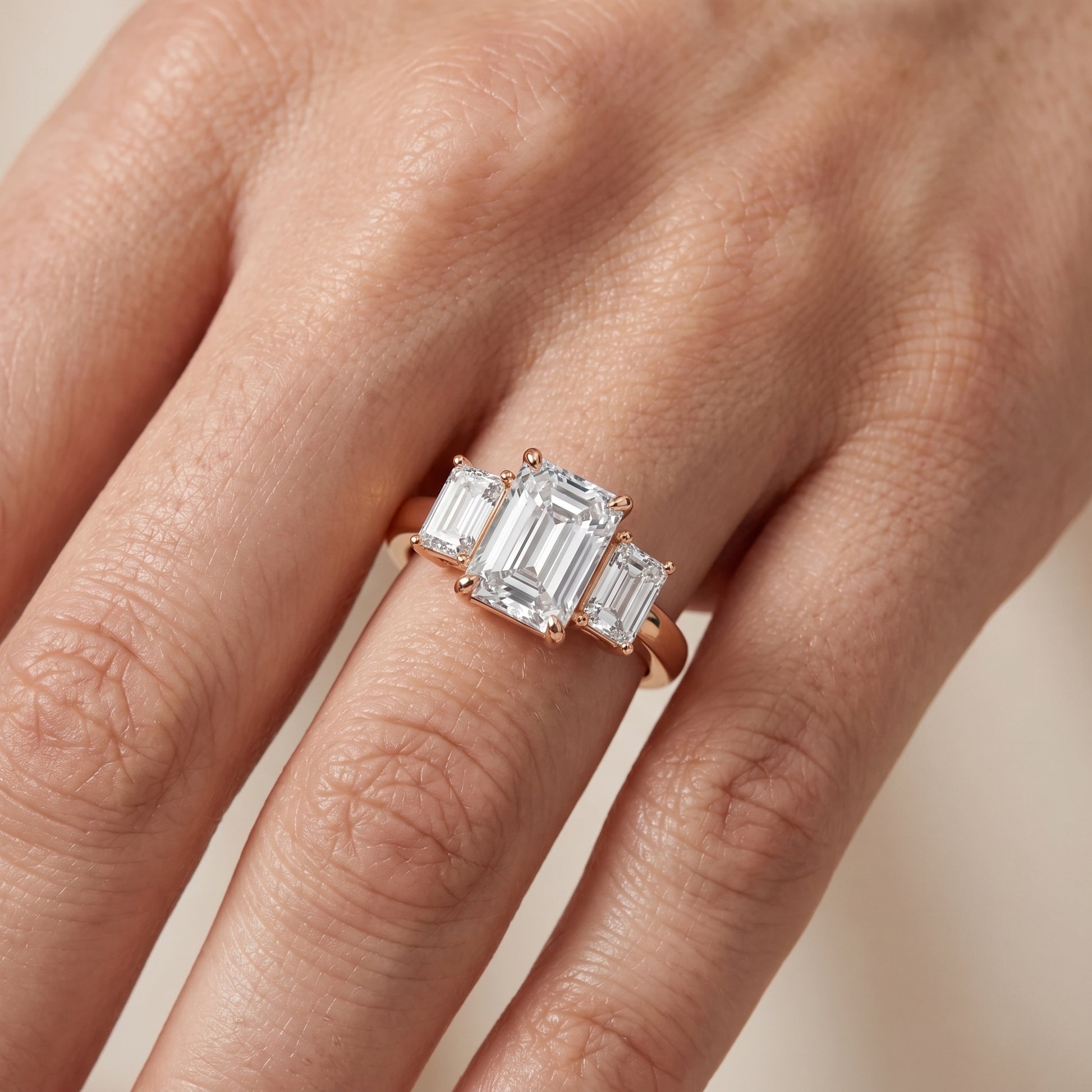 Zoe Three-Stone Emerald Diamond Ring in Rose Gold - lifestyle.jpg