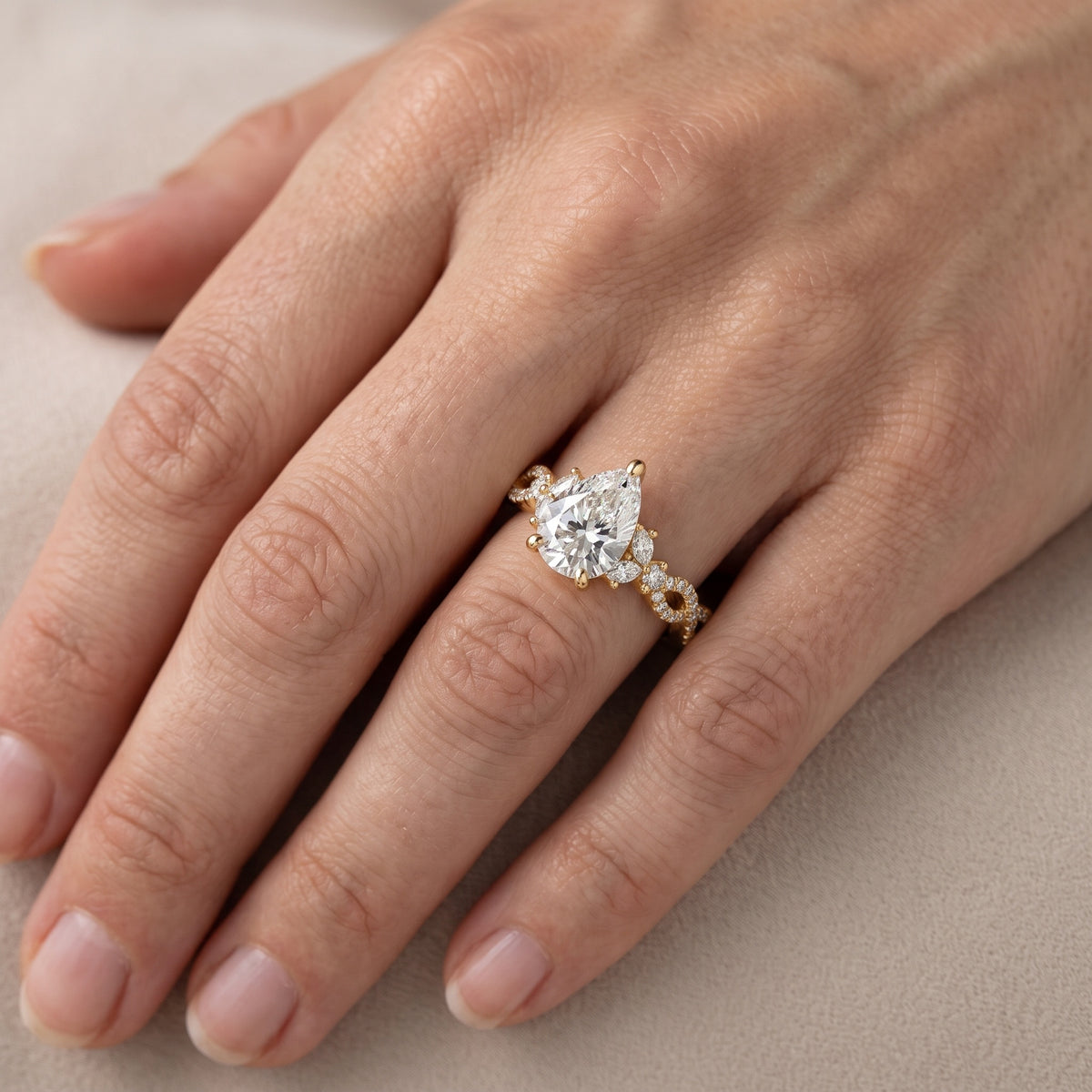 Neva Infinity Twist Pear Diamond Engagement Ring in Yellow Gold - lifestyle.jpg