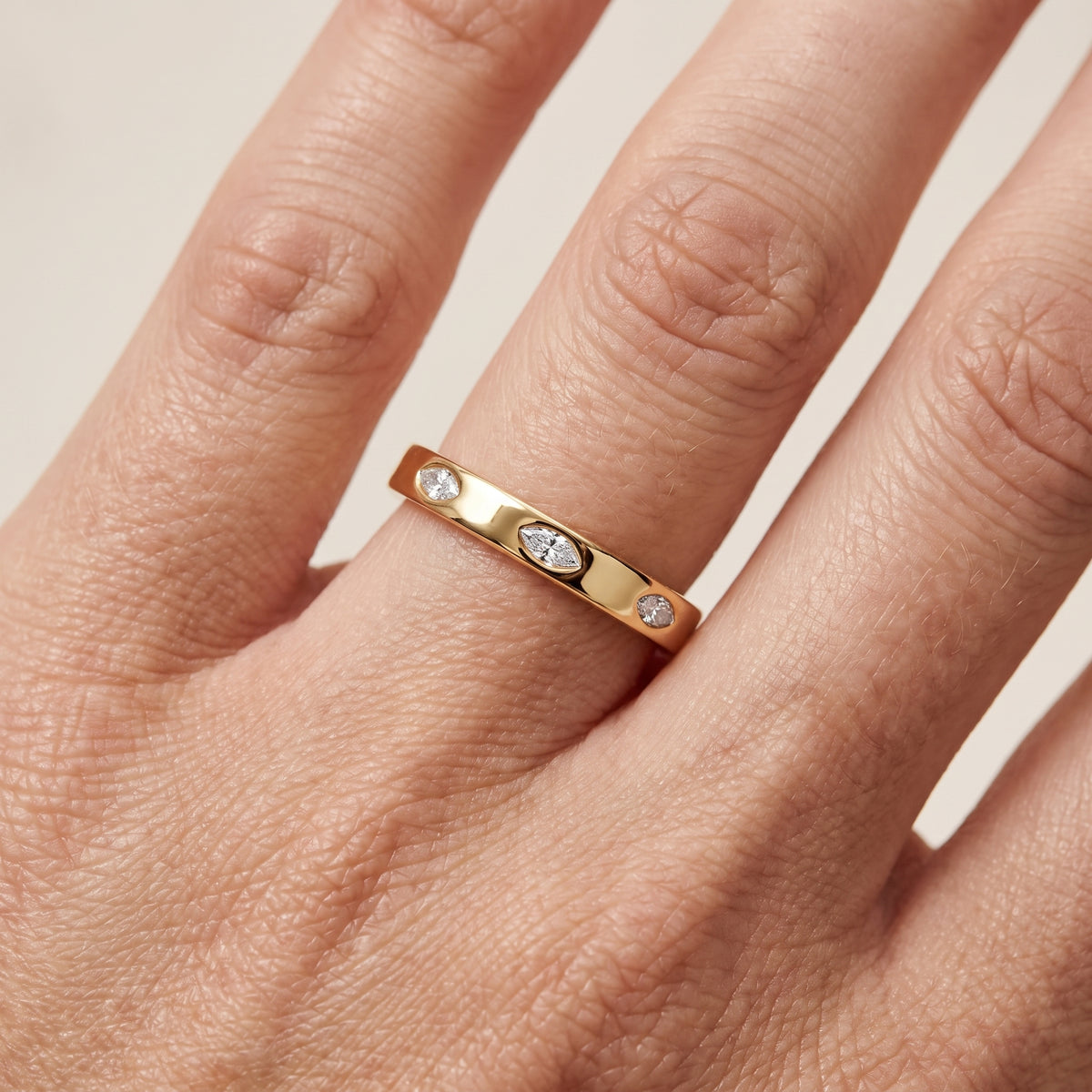 Sloane Bezel Marquise & Round Diamond Eternity Band in Yellow Gold - lifestyle.jpg