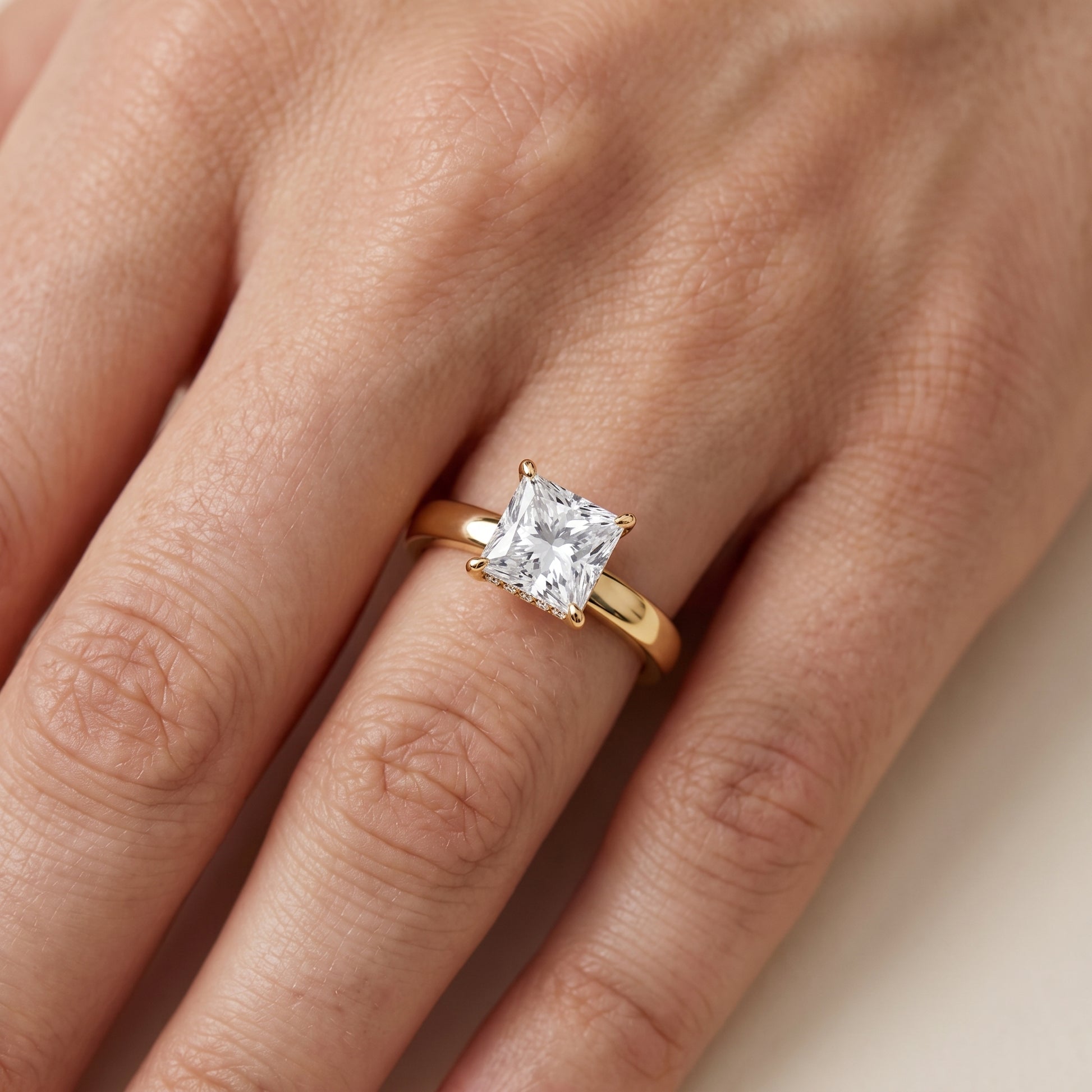 Lara Hidden Halo Princess Diamond Engagement Ring in Yellow Gold - lifestyle.jpg