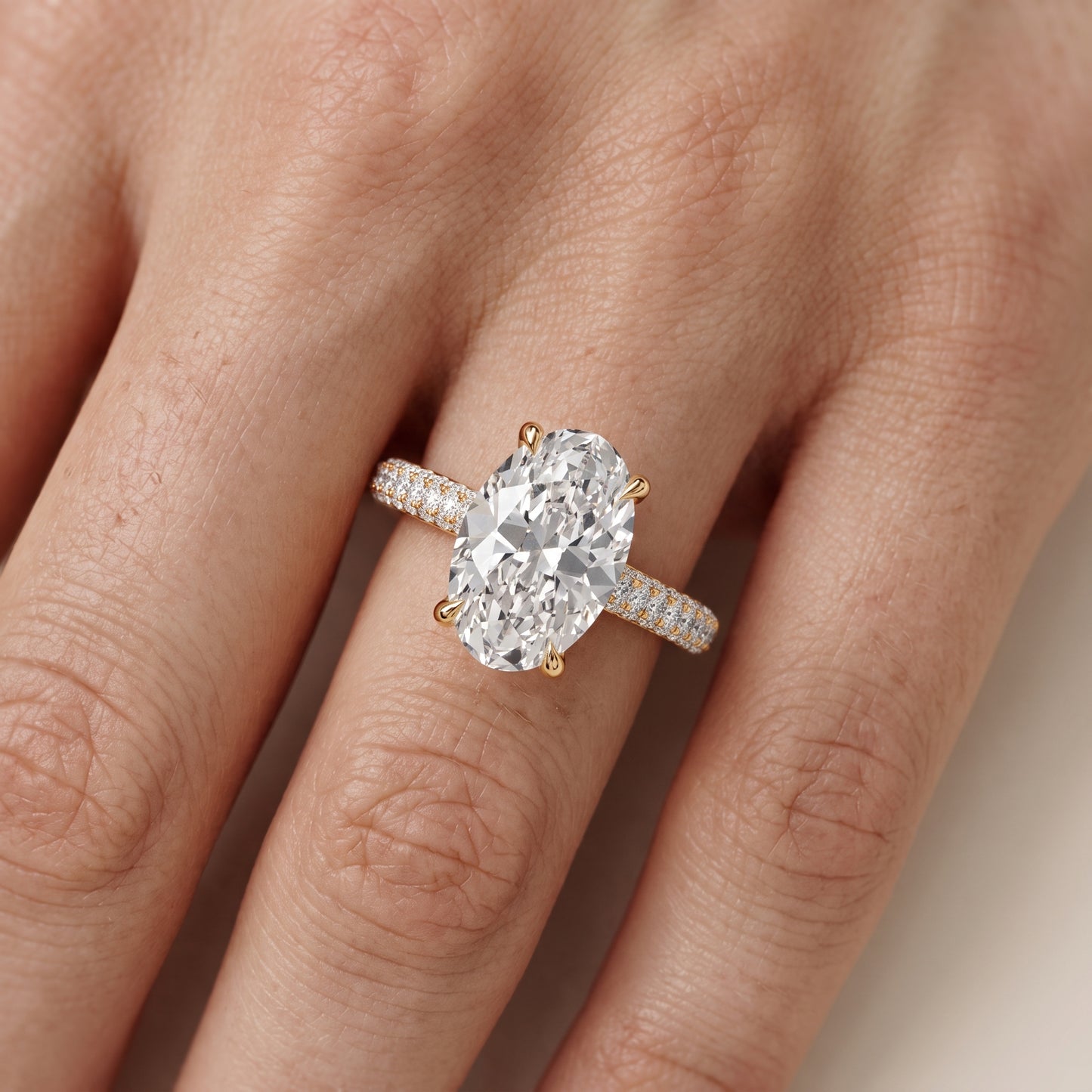 Della Hidden Halo Pavé Oval Diamond Engagement Ring in Yellow Gold - lifestyle.jpg