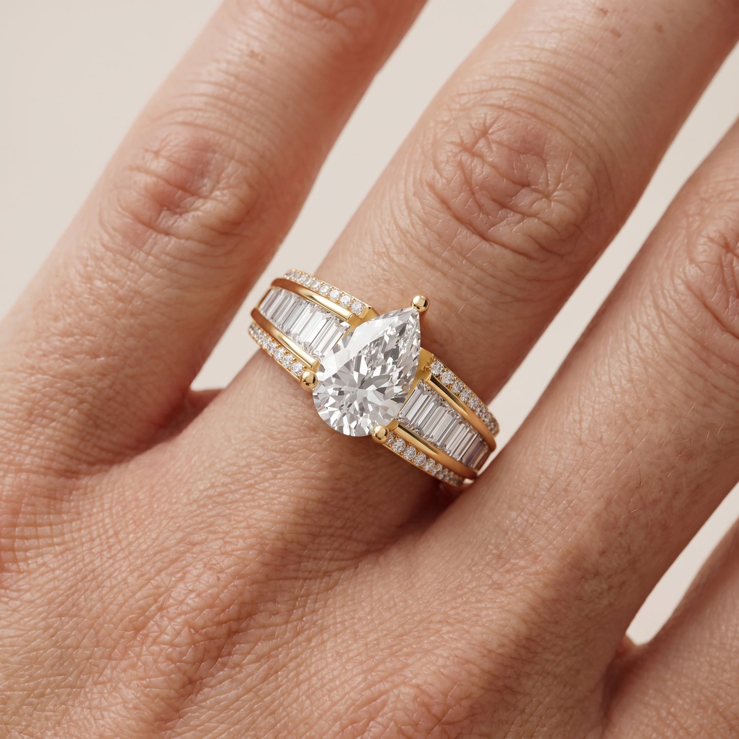 Halle Channel Set Baguette Accent Pear Diamond Engagement Ring in Yellow Gold - lifestyle.jpg