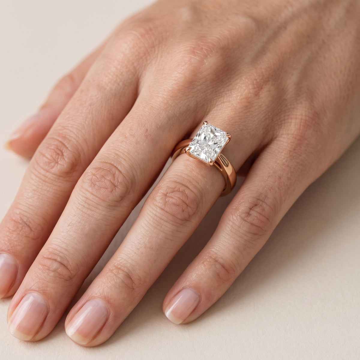 Lucia Solitaire Six-Prong Radiant Diamond Engagement Ring in Rose Gold - lifestyle.jpg