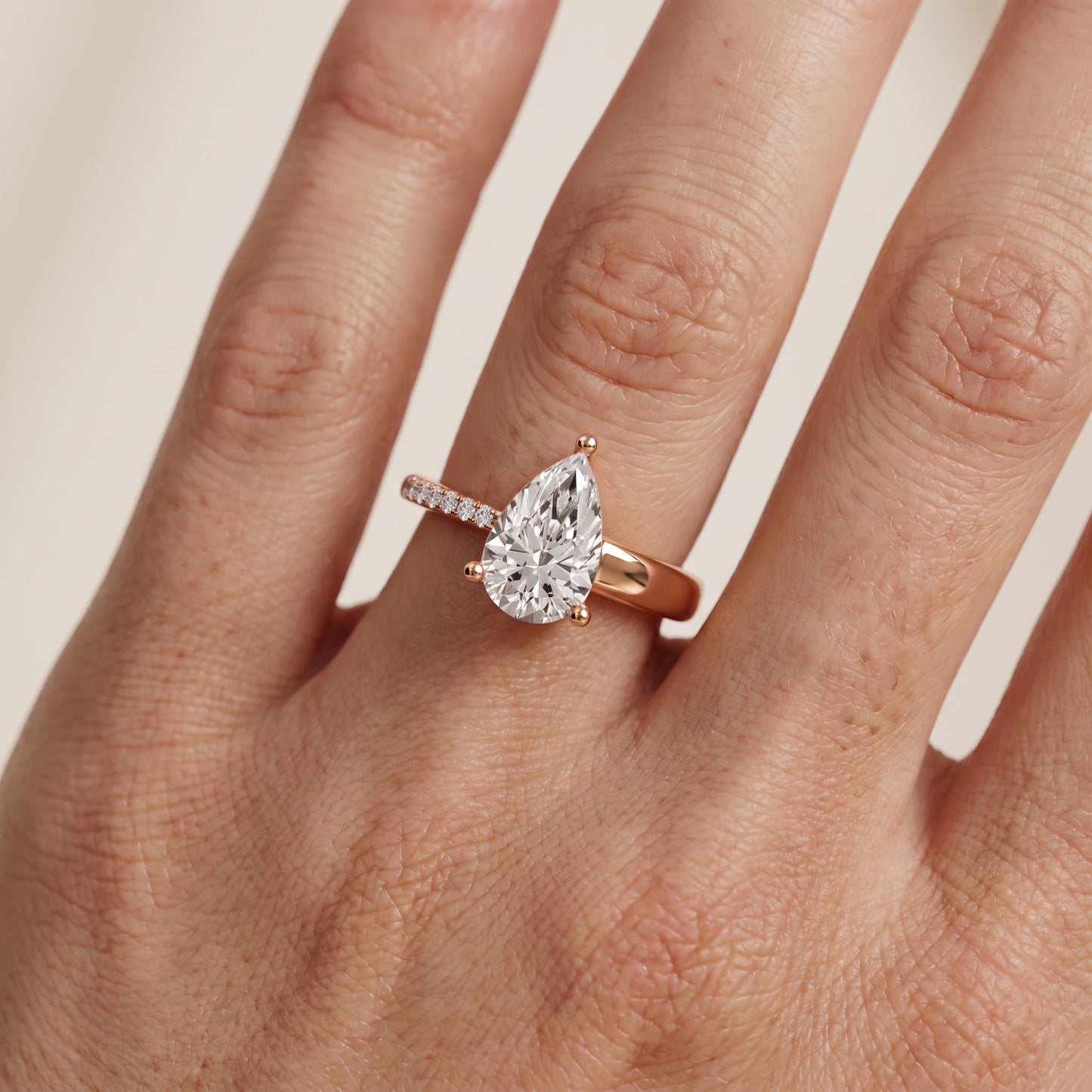 Rosie Solitaire Basket Pear Diamond Engagement Ring in Rose Gold - lifestyle.jpg