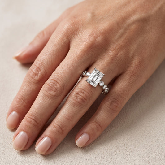 Piper Sidestone Emerald Diamond Engagement Ring in Platinum - lifestyle.jpg
