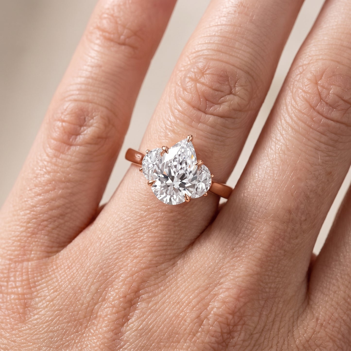 Romy Three-Stone Pear Diamond Engagement Ring in Rose Gold - lifestyle.jpg