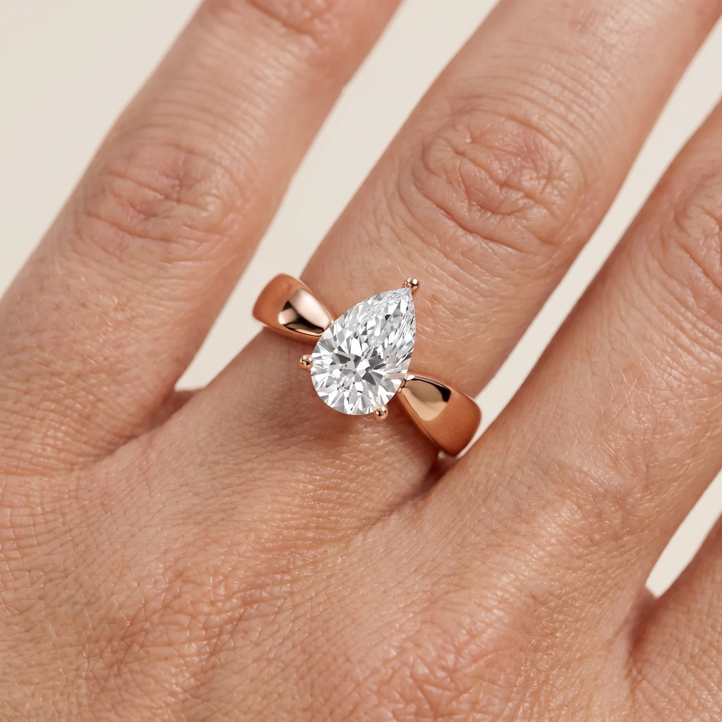 Talia Solitaire Twist Pear Diamond Engagement Ring in Rose Gold - lifestyle.jpg