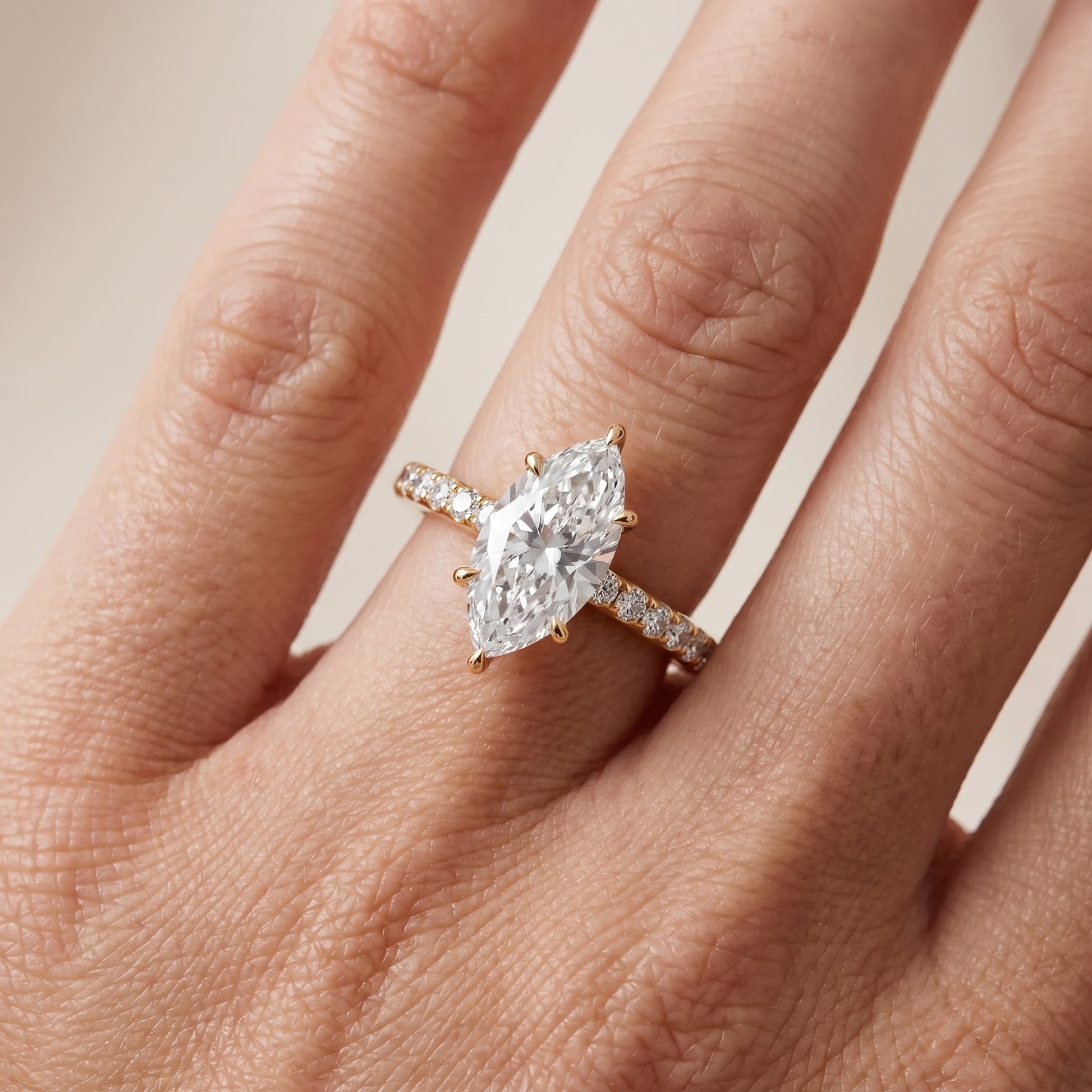 Thea Hidden Halo Pavé Marquise Diamond Engagement Ring in Yellow Gold - lifestyle.jpg