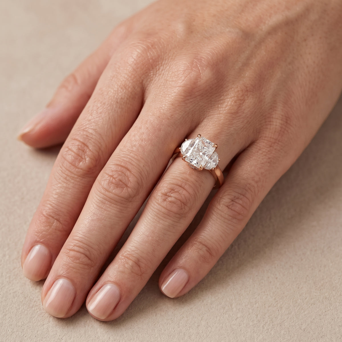 Romy Three-Stone Radiant Diamond Engagement Ring in Rose Gold - lifestyle.jpg