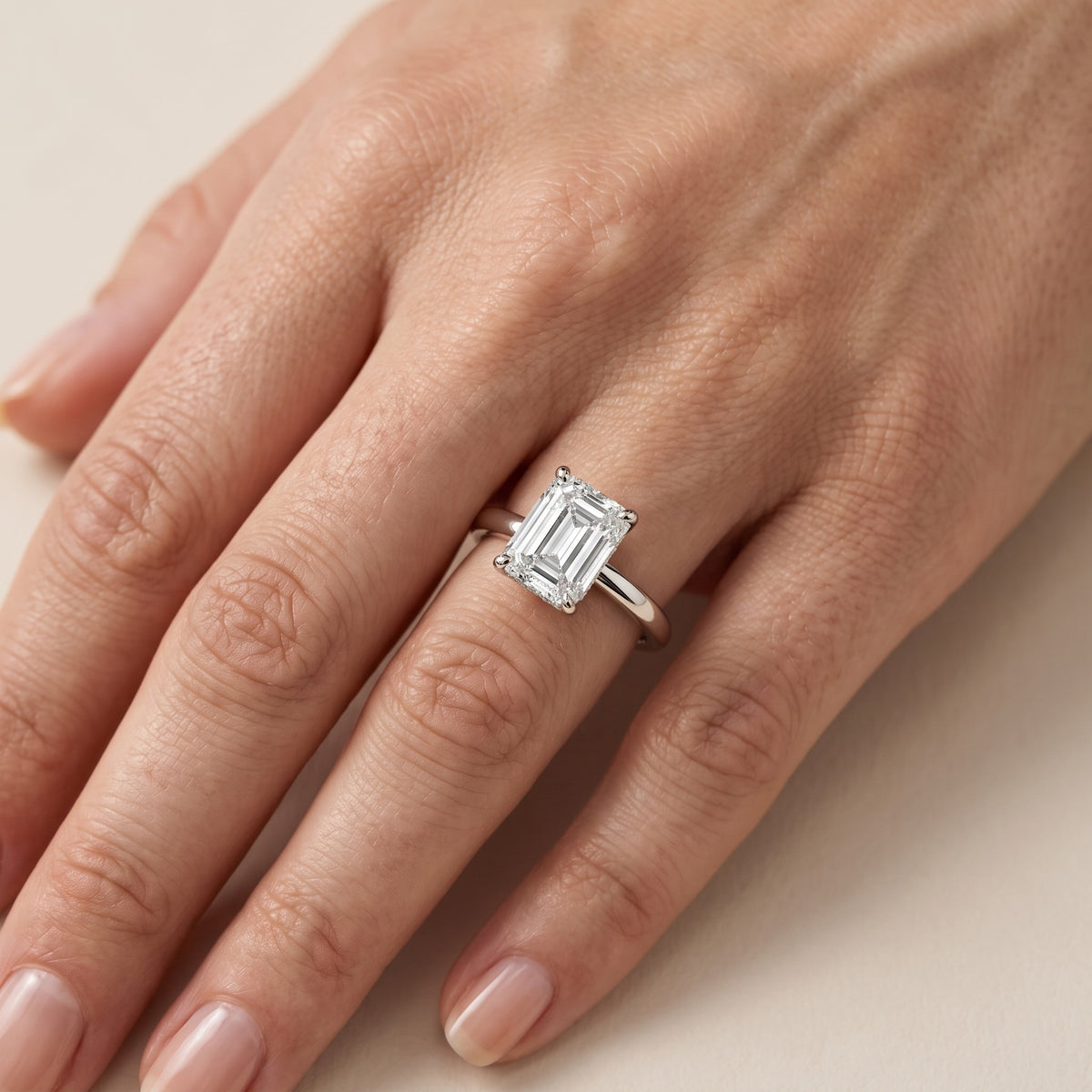 Charlotte Charm Solitaire Emerald Diamond Engagement Ring in Silver - lifestyle.jpg