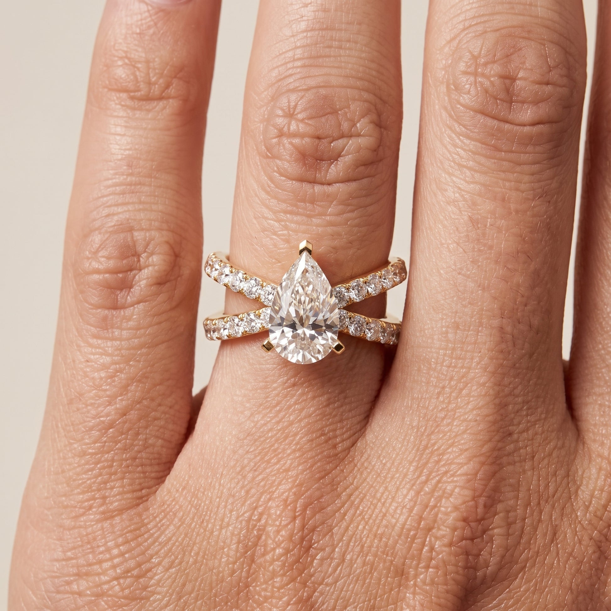 Lior Criss Cross Pavé Pear Diamond Engagement Ring in Yellow Gold - lifestyle.jpg