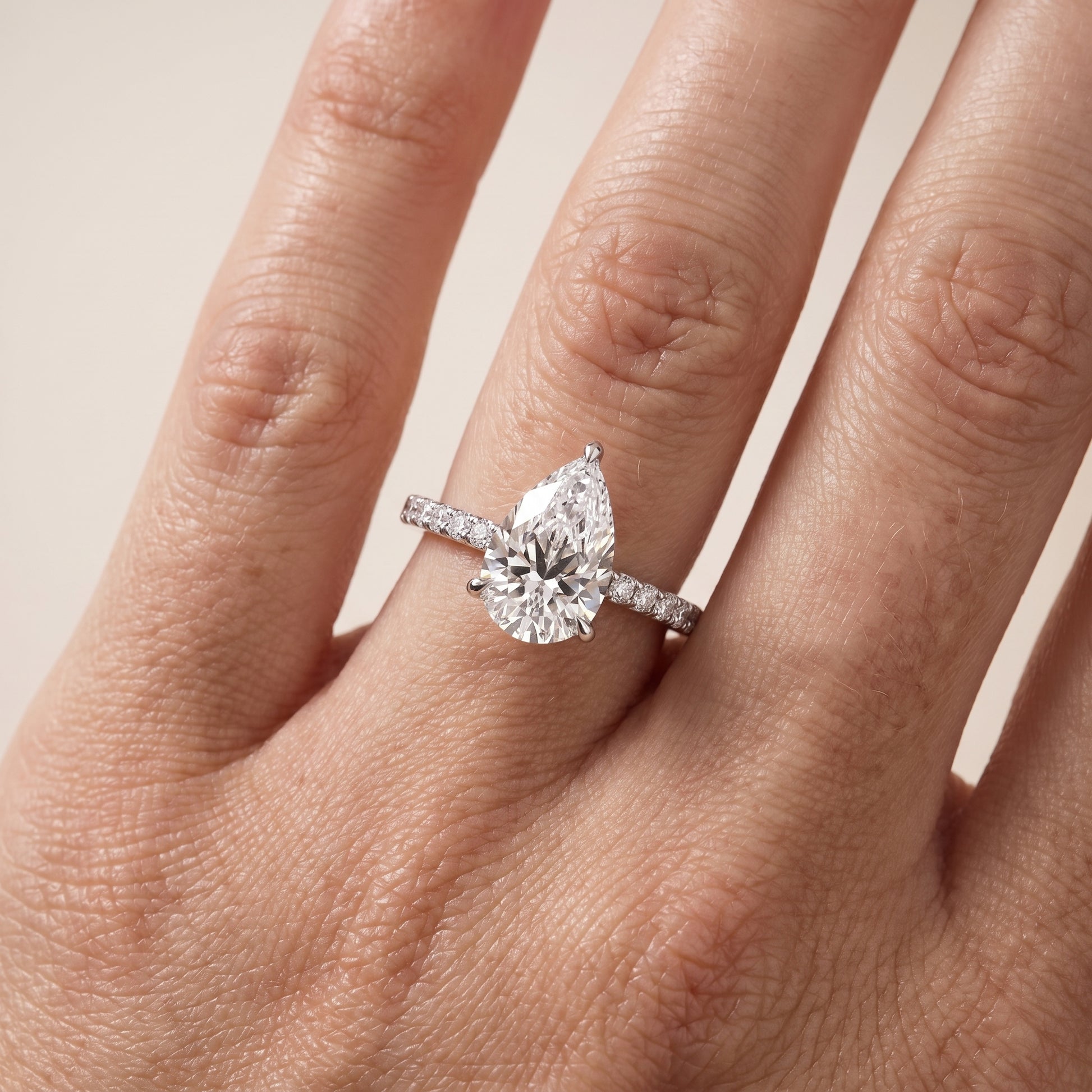 Ione Solitaire Pavé Pear Diamond Engagement Ring in White Gold - lifestyle.jpg