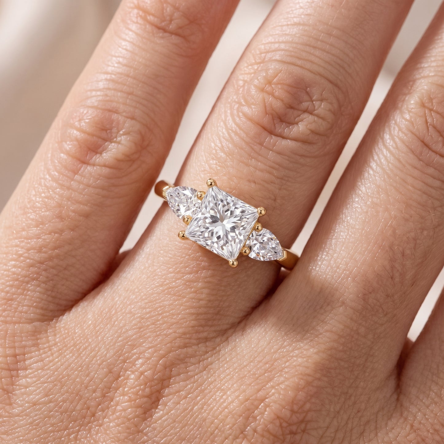 Mirabel Three-Stone Princess Diamond Engagement Ring in Yellow Gold - lifestyle.jpg